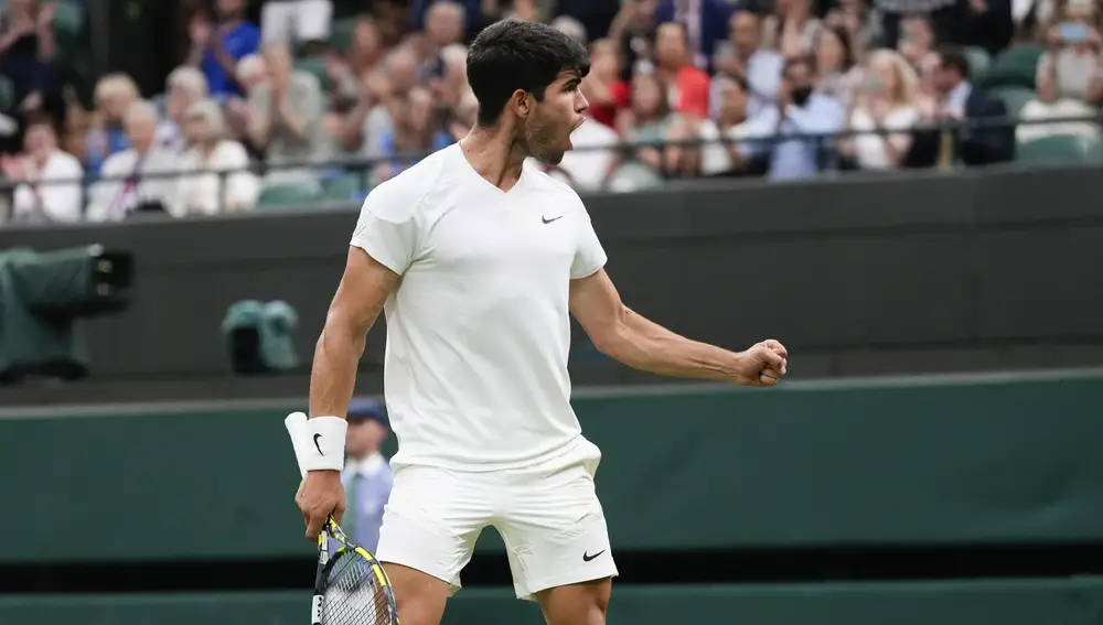 Carlos Alcaraz of Spain reacts after defeating Tommy Paul of the United States in their quarterfinal match at the Wimbledon tennis championships in London, Tuesday, July 9, 2024.