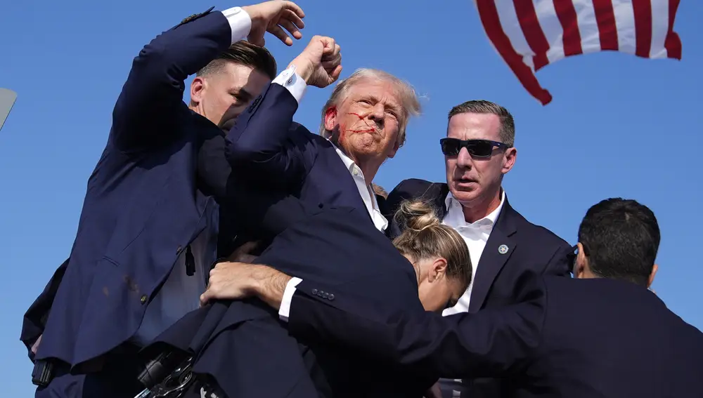 Republican presidential candidate former President Donald Trump is surround by U.S. Secret Service agents at a campaign rally, Saturday, July 13, 2024, in Butler, Pa. (AP Photo/Evan Vucci)