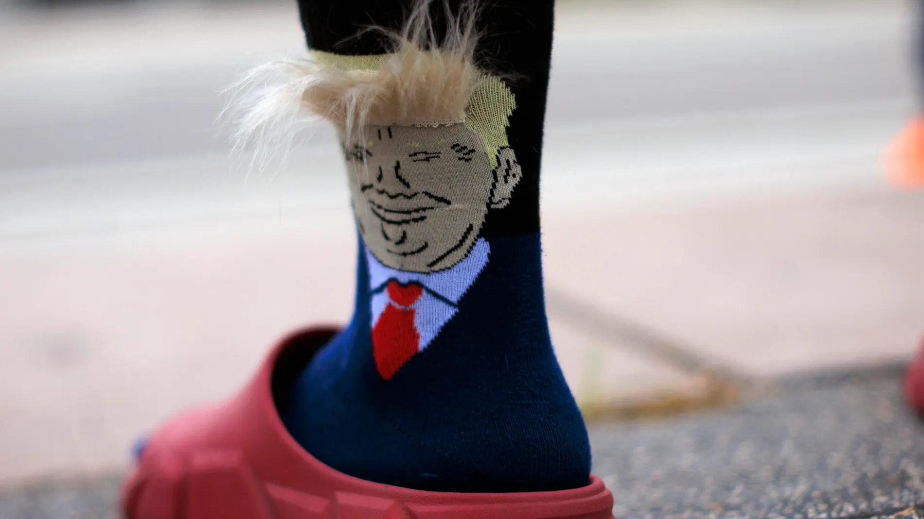 Miami (United States), 13/07/2024.- A supporter of former US President Donald Trump wears socks with his likeness while taking part in a demonstration in his support in Miami, Florida, USA, 13 July 2024. Trump was rushed off stage by secret service after an incident during a campaign rally in Pennsylvania. According to the Butler County district attorney a suspected gunman was dead and at least one rally attendee was killed. EFE/EPA/CJ GUNTHER