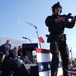 Republican presidential candidate former President Donald Trump is covered by U.S. Secret Service agents at a campaign rally, Saturday, July 13, 2024, in Butler, Pa