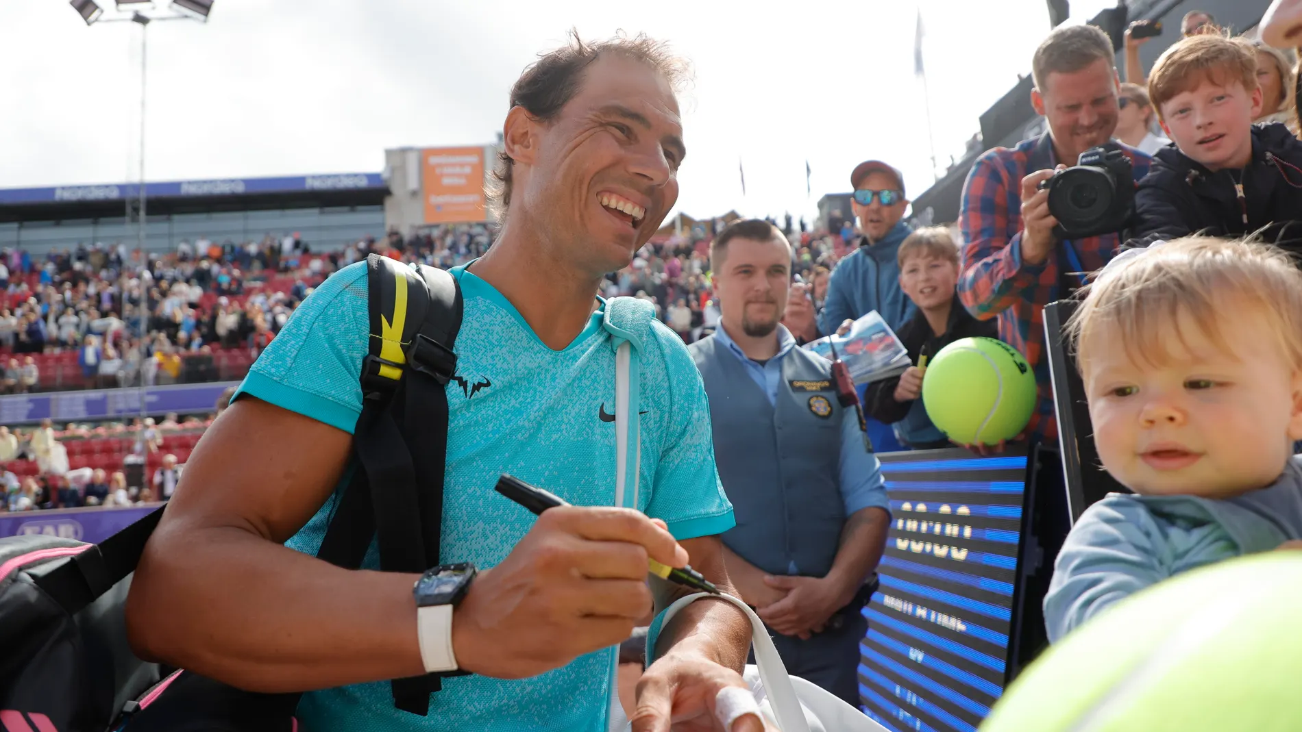 Bastad (Sweden), 15/07/2024.- Rafael Nadal of Spain signs autographs after winning the doubles match with Casper Ruud of Norway against Miguel Angel Reyes-Varela of Mexico and Guido Andreozzi of Argentina at the Nordea Open Tennis tournament in Bastad, Sweden, 15 July 2024. (Tenis, Noruega, España, Suecia) EFE/EPA/ADAM IHSE SWEDEN OUT