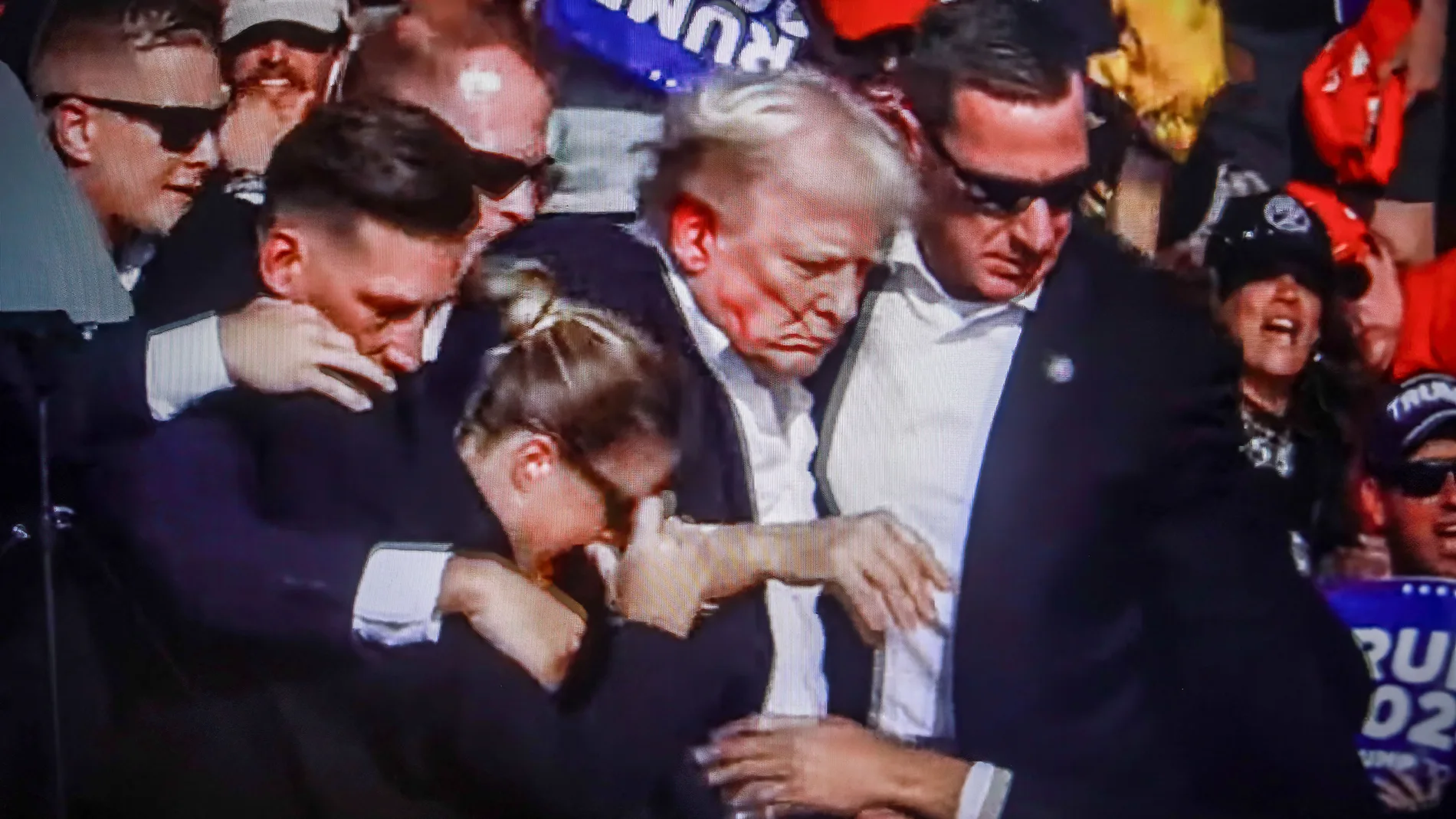 July 14, 2024, Butler, Pennsylvania, United States: In this photo illustration, a screen shows Former US President Donald Trump shot in the ear at a rally he was holding in Butler. Former US President Donald Trump was wounded in a shooting at a rally he was holding in Butler, Pennsylvania as part of his election campaign ahead of the 2024 US Presidential election. According to the latest reports, secret agents killed a shooter and one rally participant died at the hands of the shooter himself...