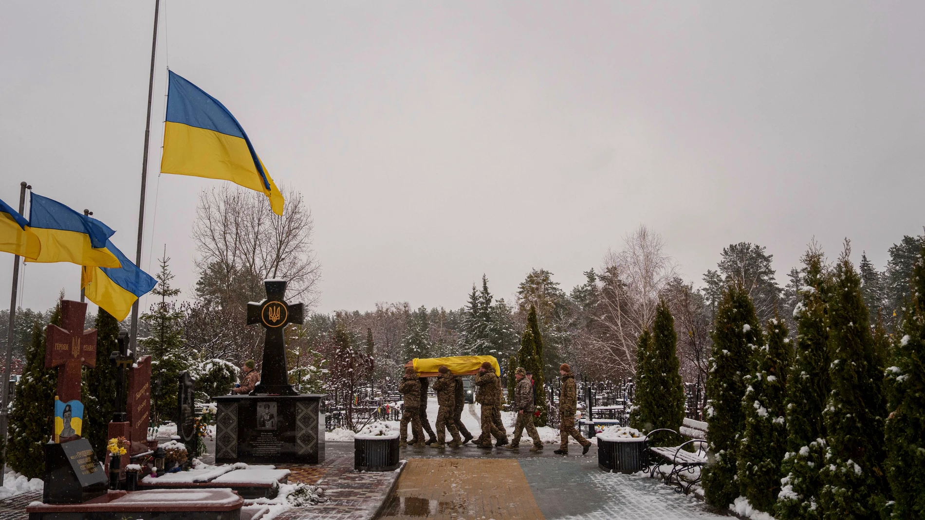 Honor Guards carry the coffin of fallen Ukrainian serviceman of the 47th brigade Serhii Solovyov, who was killed during fighting with Russian Forces in Kursk oblast on November 12, during the funeral ceremony in Irpin, Kyiv region, Ukraine, Nov. 21, 2024. (AP Photo/Evgeniy Maloletka)