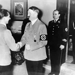 German Chancellor Adolf Hitler, right, congratulates Dr. Joseph Goebbels on his 40th birthday at the ministry of propaganda and public enlightenment in Berlin, Germany, Oct. 29, 1937. The Fuehrer presented the minister of propaganda with a painting.