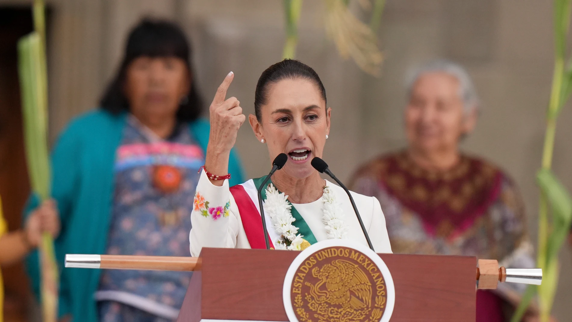 FILE - Newly-sworn in President Claudia Sheinbaum addresses supporters in the Zócalo, Mexico City's main square, on Oct. 1, 2024. (AP Photo/Fernando Llano, File)
