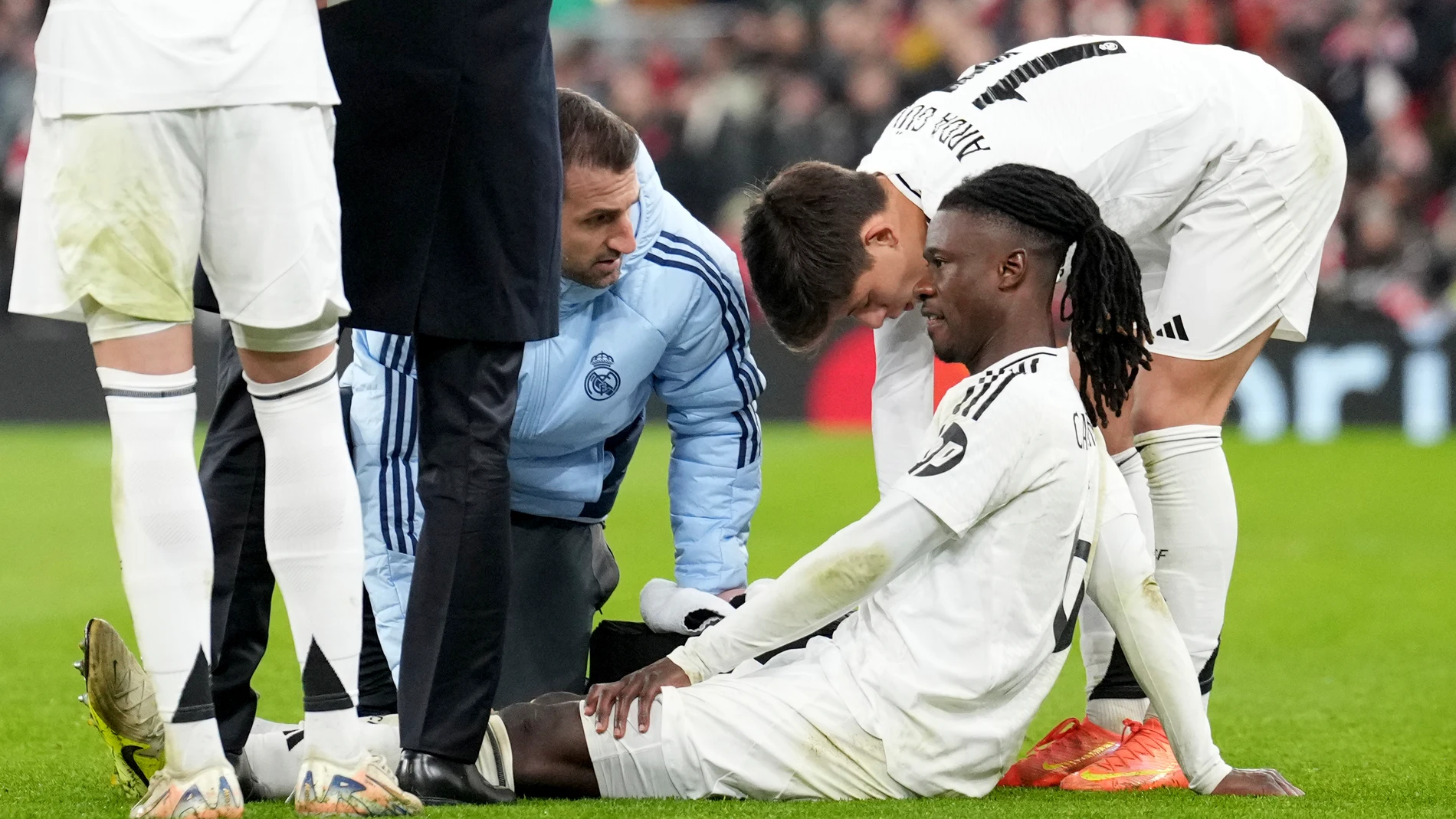 Real Madrid's Eduardo Camavinga is assisted after getting injured during the Champions League opening phase soccer match between Liverpool and Real Madrid at Anfield Stadium, Liverpool, England, Wednesday, Nov. 27, 2024. (AP Photo/Jon Super)