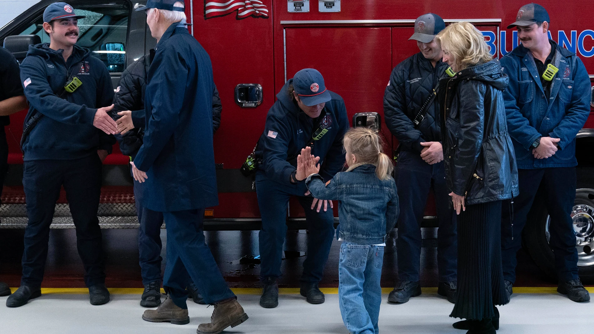 President Joe Biden, first lady Jill Biden and their grandson Beau shake hands with members of Nantucket fire department during a visit on Thanksgiving day in Nantucket Mass., Thursday, Nov. 28, 2024. (AP Photo/Jose Luis Magana)