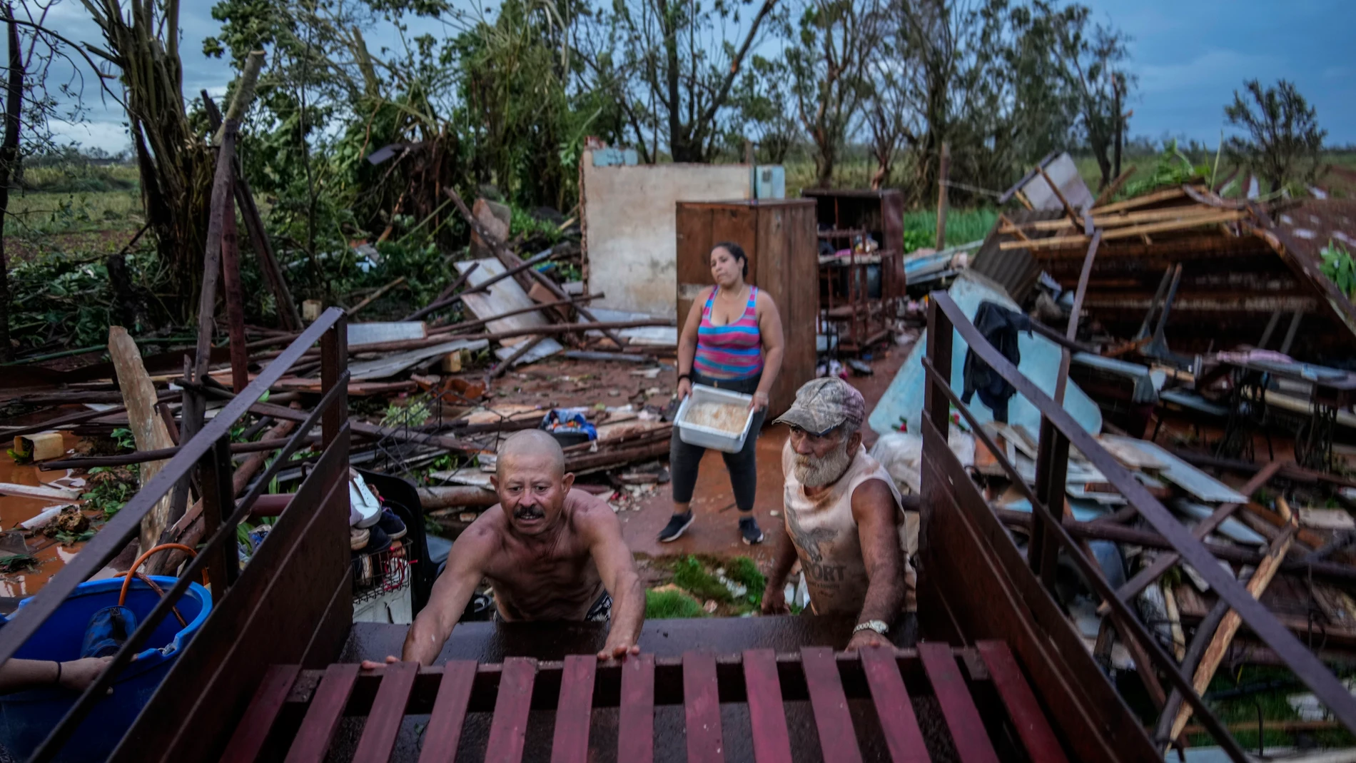 FILE - People recover belongings from their houses, which were destroyed by Hurricane Rafael, in Alquizar, Cuba, Nov. 7, 2024. (AP Photo/Ramon Espinosa, File)