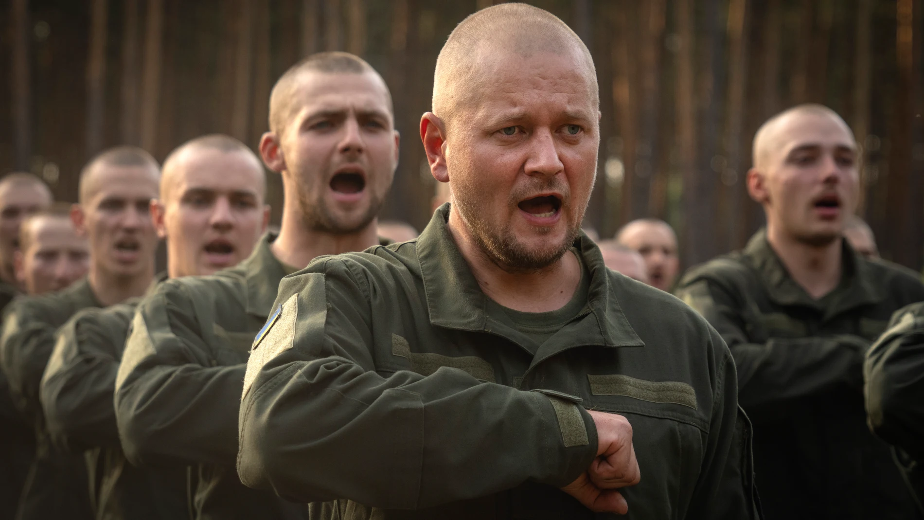 FILE - Newly recruited soldiers toss their hats as they celebrate the end of their training at a military base close to Kyiv, Ukraine, on Sept. 25, 2023. (AP Photo/Efrem Lukatsky, File)