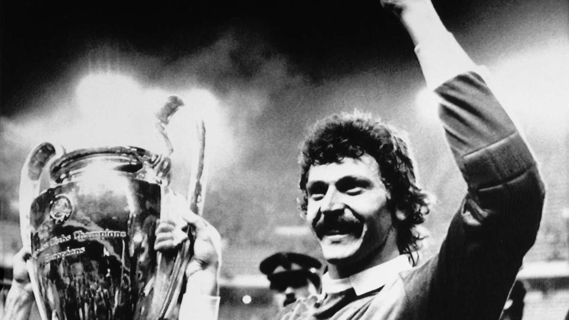 FILE - Steaua Bucharest goalkeeper Helmuth Duckadam raises the European Champions Cup after the Romainian team defeated Barcelona in penalties in Seville, Spain, May 7, 1986. Former Steaua Bucharest goalkeeper Helmuth Duckadam, who saved four penalties in the 1986 European Cup final shootout win against Barcelona, died on Monday. He was 65. (AP Photo/Fernando Ricardo, File)
