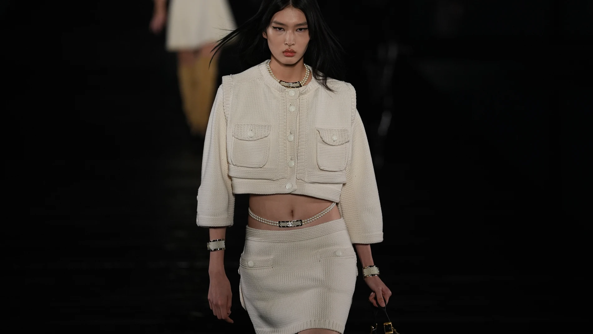 A model wears the latest creation from Chanel during the Chanel Metiers d'art 2024/25 fashion show at the Impression West Lake venue in Hangzhou, China on Tuesday, Dec. 3, 2024. (AP Photo/Ng Han Guan)