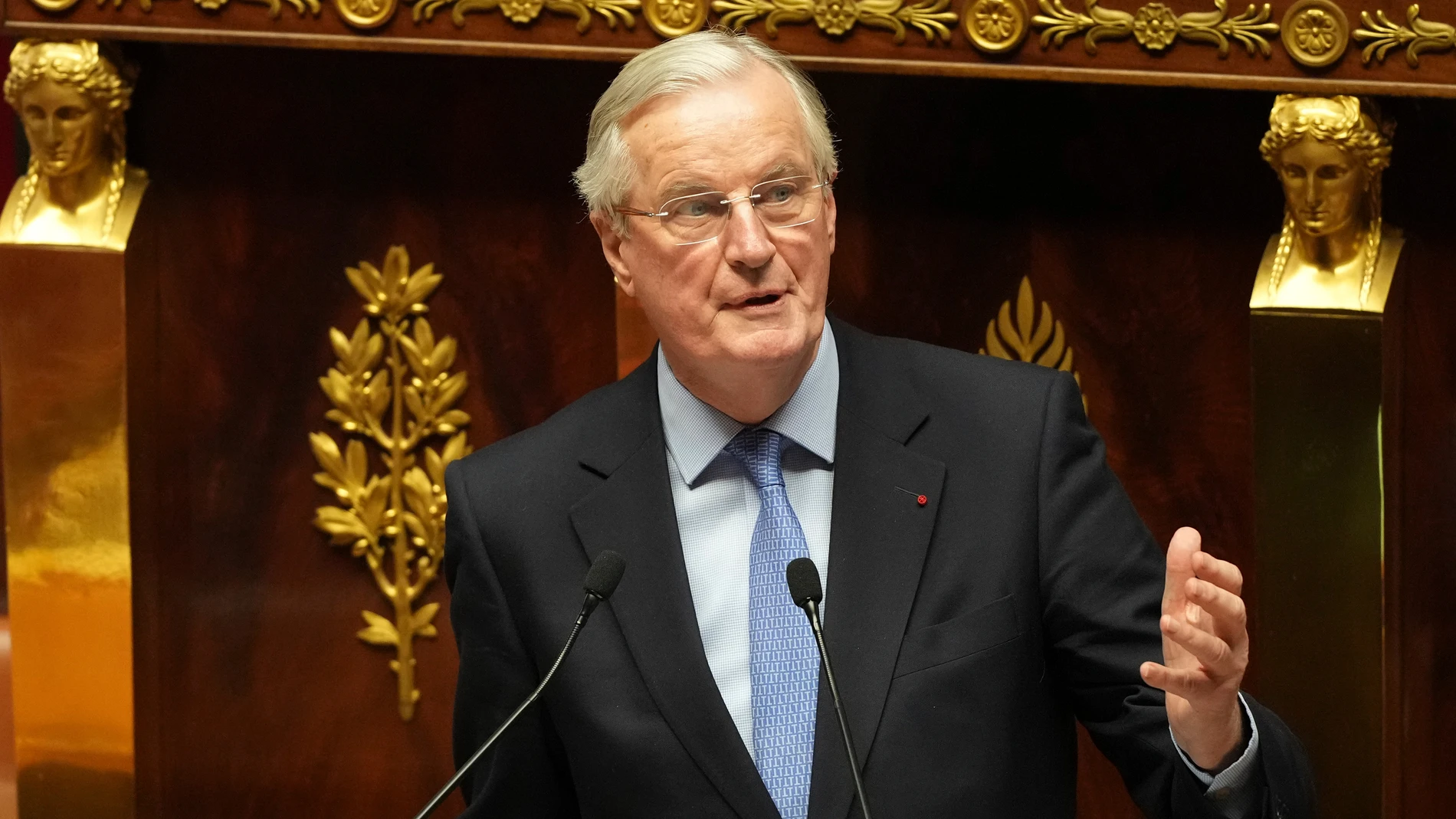 French Prime Minister Michel Barnier addresses the National Assembly prior to a vote on a no-confidence motion that could bring him down and his cabinet for the first time since 1962, Wednesday, Dec. 4, 2024 in Paris. (AP Photo/Michel Euler)