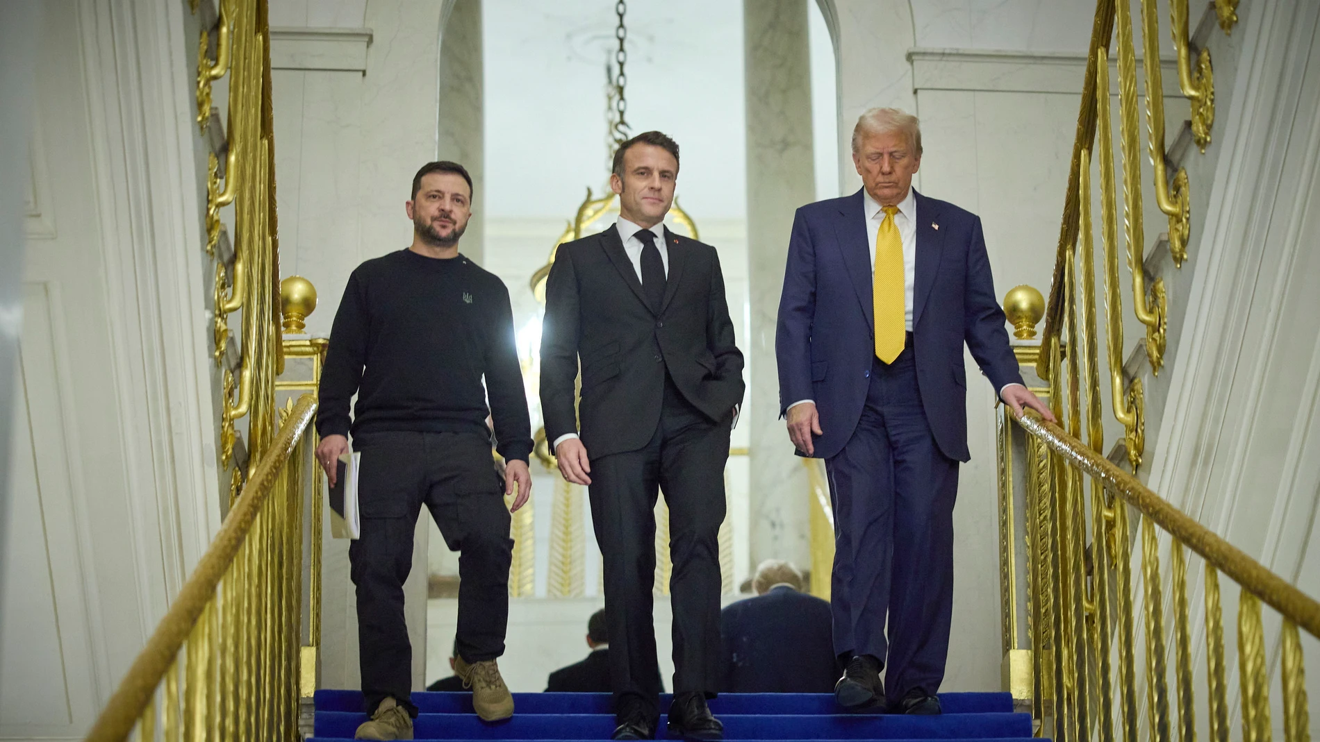 Paris (France), 07/12/2024.- A handout picture made available by the Presidential Press Service of Ukraine shows (L-R) Ukrainian President Volodymyr Zelensky, French President Emmanuel Macron, and US President-elect Donald Trump during their meeting at the Elysee Palace, as part of ceremonies marking the reopening of the Notre Dame de Paris Cathedral, in Paris, France, 07 December 2024. The Notre Dame de Paris Cathedral reopens on 07 December after nearly six years of renovation work followin...