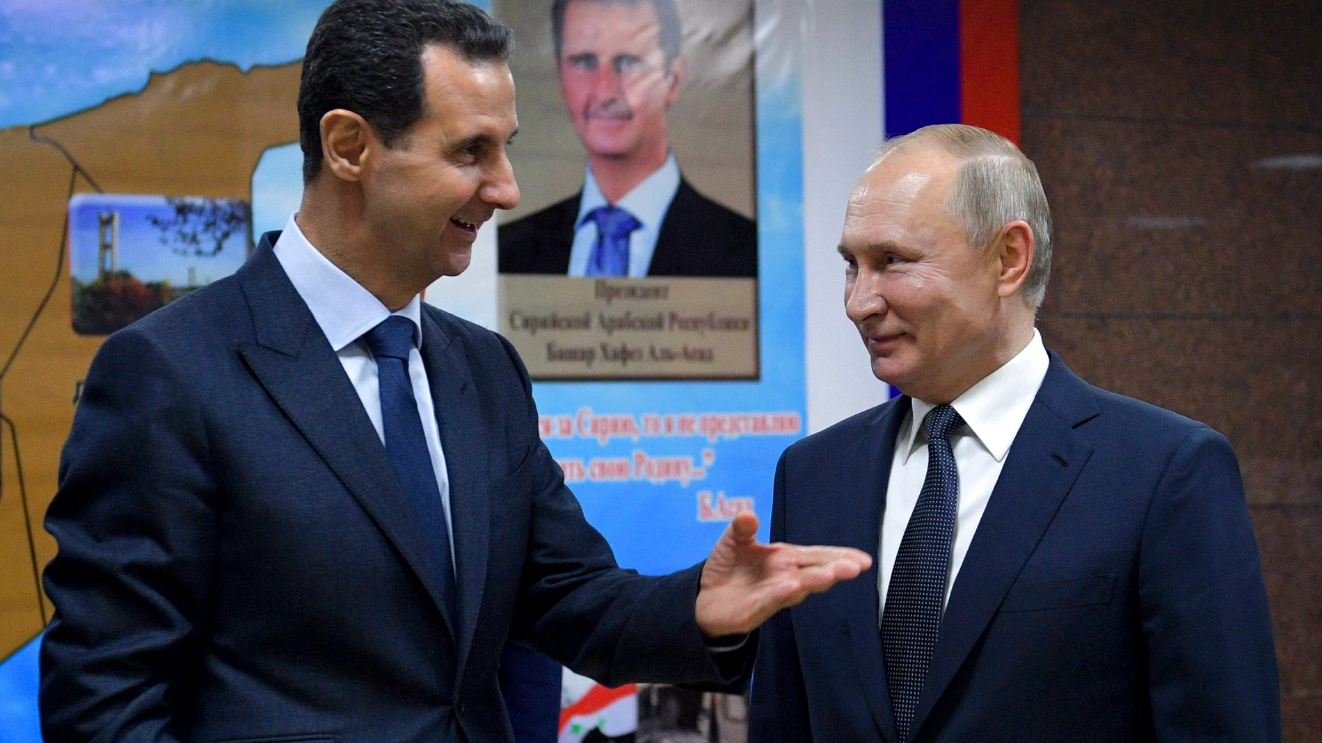 FILE - Syrian President Bashar Assad, left, gestures while speaking to Russian President Vladimir Putin during their meeting in Damascus, Syria, Jan. 7, 2020. (Alexei Druzhinin, Sputnik, Kremlin Pool Photo via AP, File)