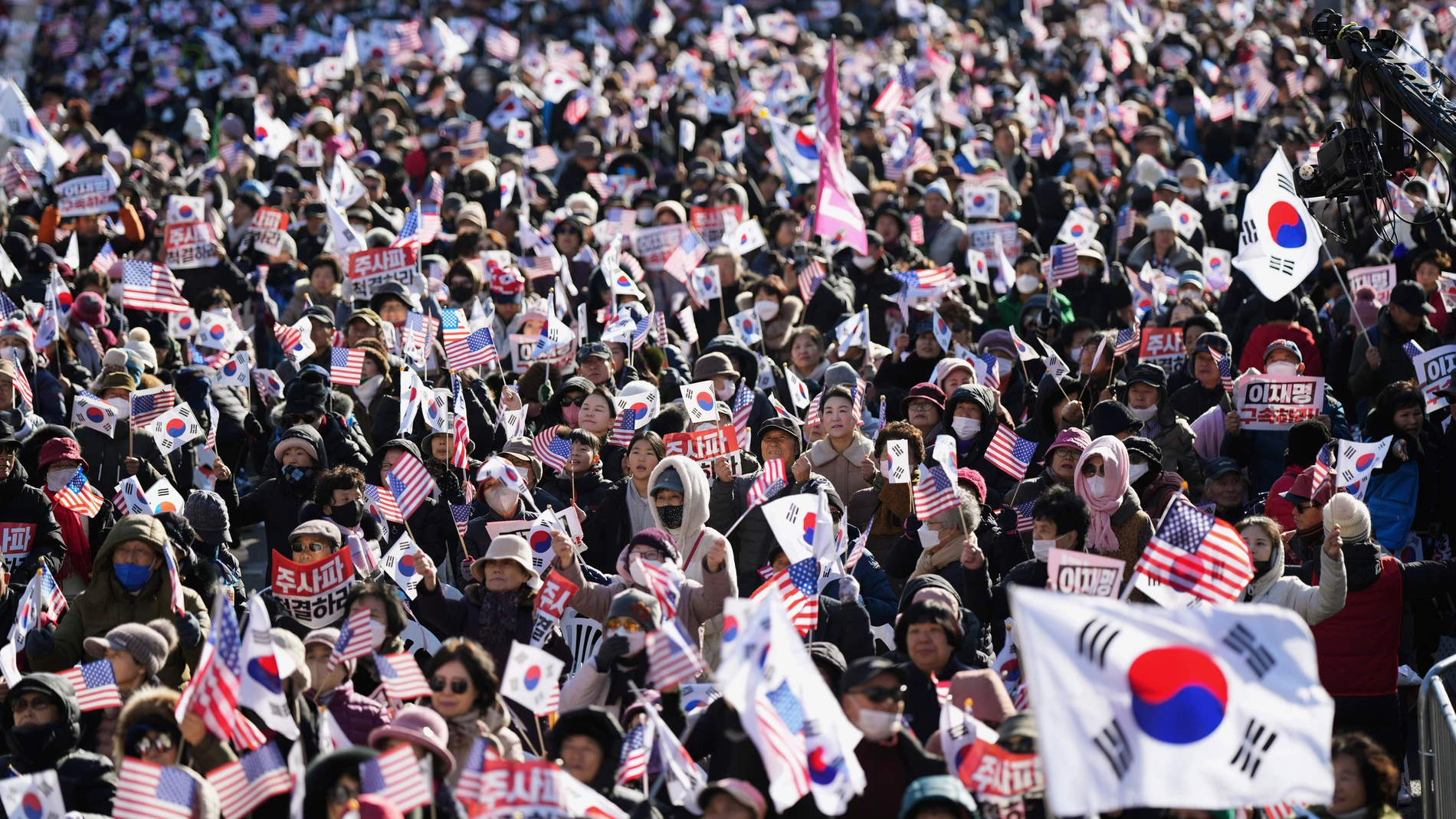 Conservative groups supporting South Korean President Yoon Suk Yeol rally denouncing opposition parties' lawmakers who demand impeachment of Yoon following his short-lived martial law declaration in Seoul, South Korea, Dec. 7, 2024. (AP Photo/Lee Jin-man)