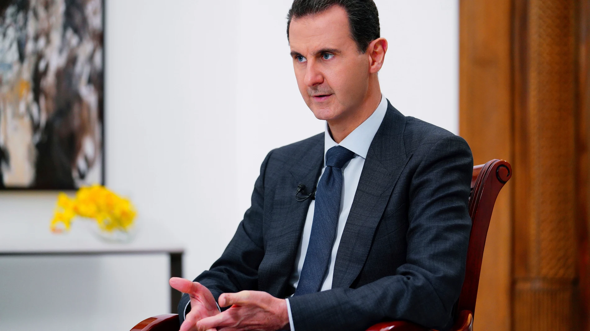 FILE - In this photo released Nov. 9, 2019, by the official news agency SANA, then-President Bashar Assad speaks in Damascus, Syria. (SANA FILE via AP, File)