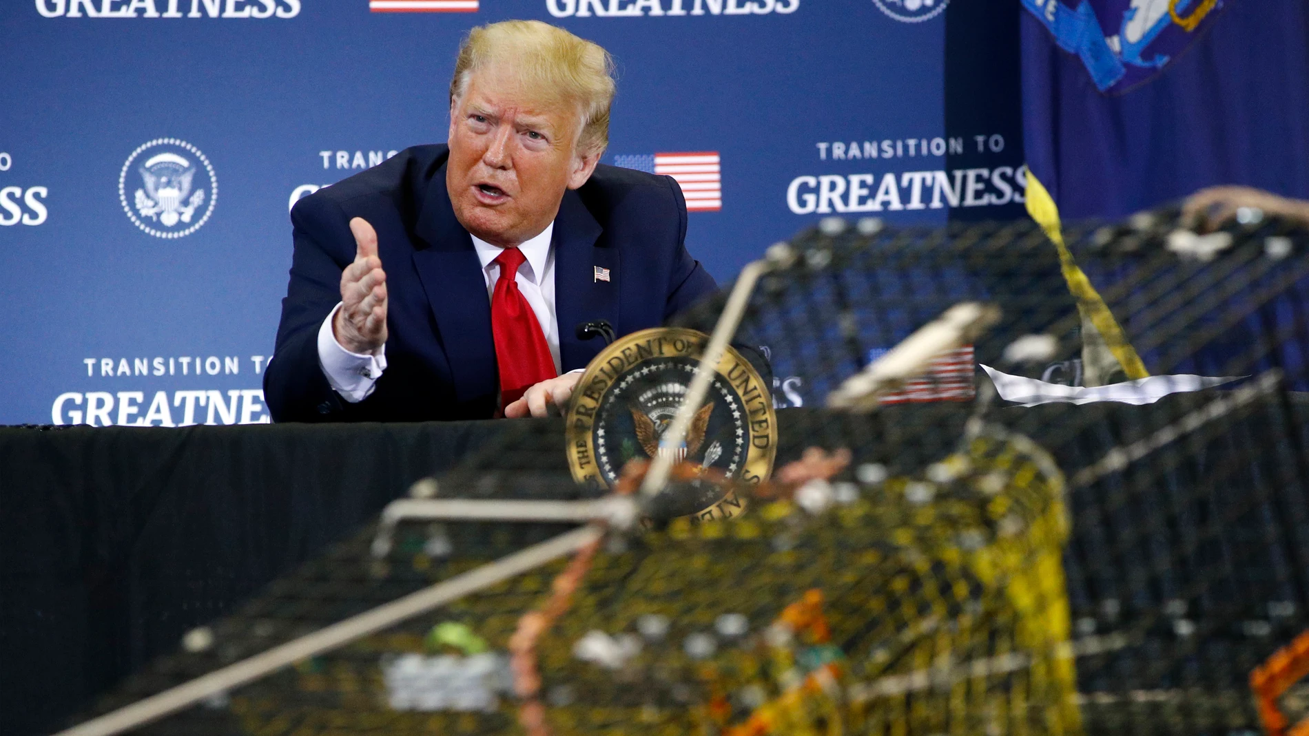FILE - President Donald Trump attends a roundtable discussion with commercial fishermen at Bangor International Airport in Bangor, Maine, June 5, 2020. (AP Photo/Patrick Semansky, File)