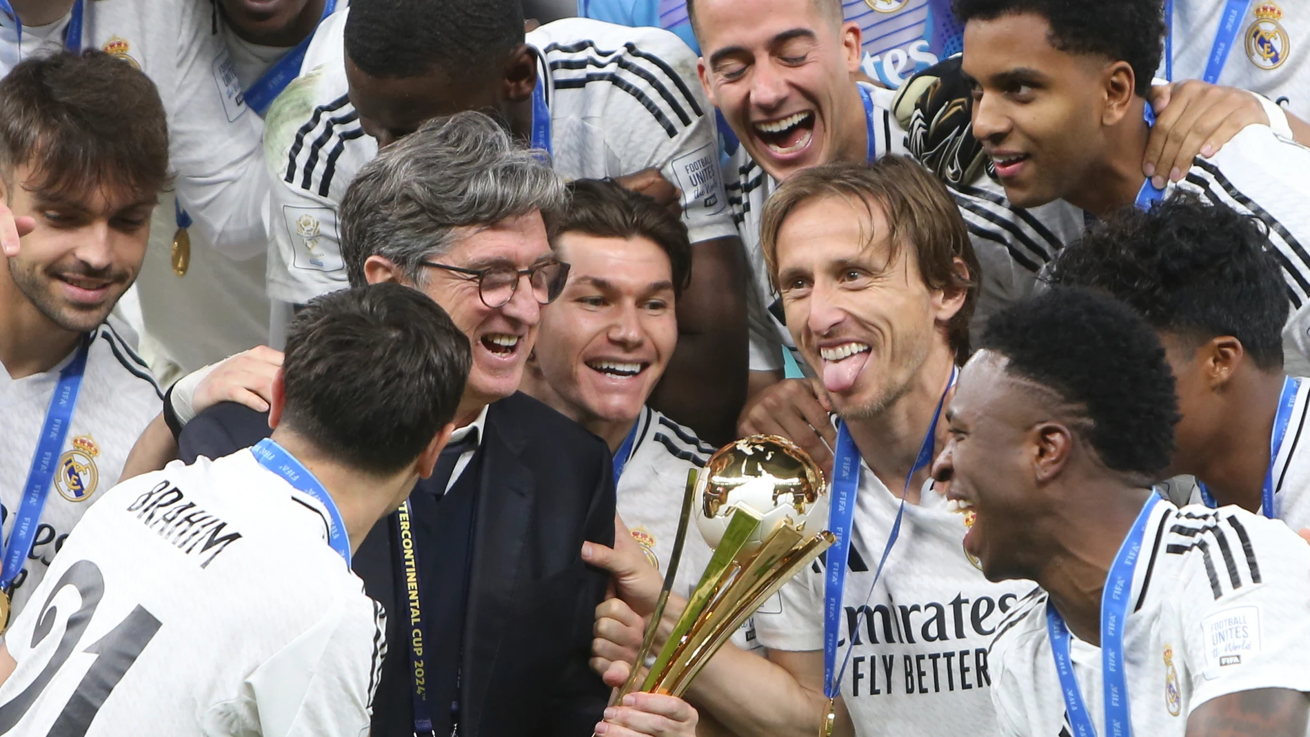 Real Madrid's players celebrate with the trophy after winning the Intercontinental Cup soccer final match against CF Pachuca at the Lusail Stadium in Lusail, Qatar, Wednesday, Dec. 18, 2024. Real Madrid won the game 3-0.(AP Photo/Hussein Sayed)