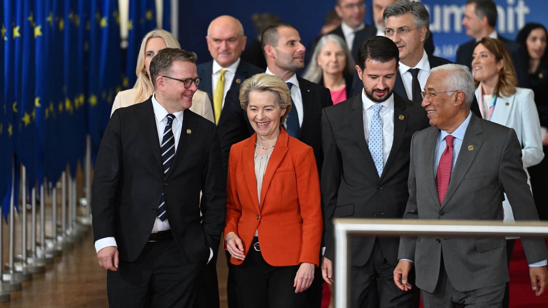 Front row from left, Finland's Prime Minister Petteri Orpo, European Commission President Ursula von der Leyen, Montenegro's President Jakov Milatovic and European Council President Antonio Costa walk with other leaders toward a group photo during an EU-Western Balkans summit in Brussels, Wednesday, Dec. 18, 2024. (AP Photo/Harry Nakos)