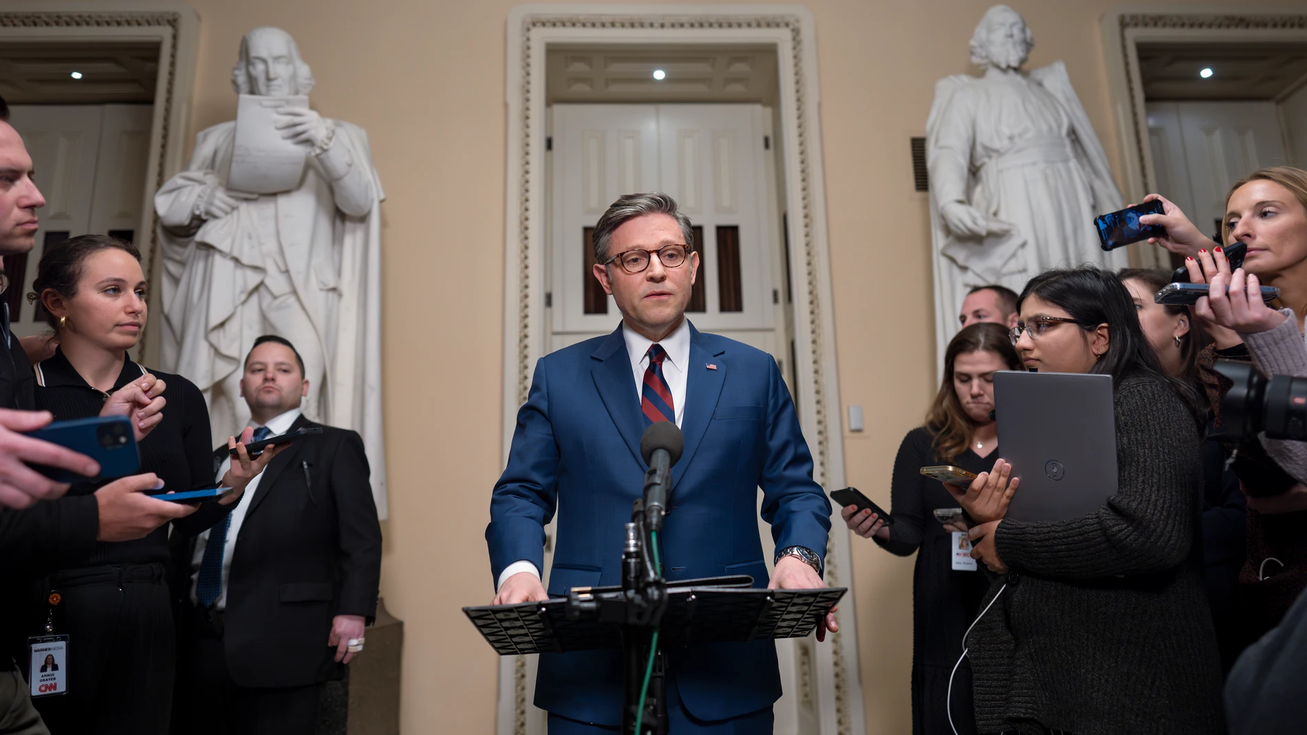 Speaker of the House Mike Johnson, R-La., talks briefly to reporters just before a vote on an interim spending bill to prevent a government shutdown, at the Capitol in Washington, Thursday, Dec. 19, 2024. The vote failed to pass. (AP Photo/J. Scott Applewhite)