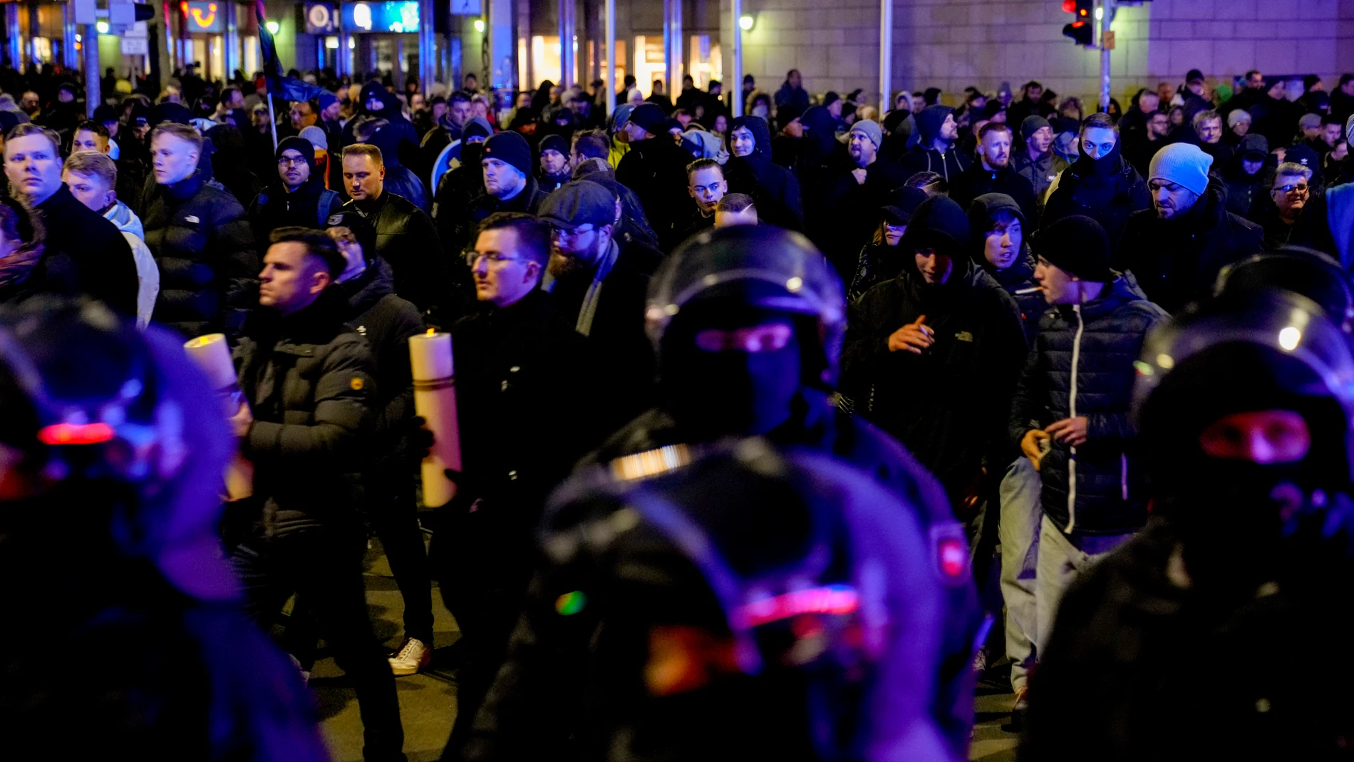 German police officers guard an AfD election campaign in front of the cathedral in Magdeburg, Germany, Monday, Dec. 23, 2024.(AP Photo/Ebrahim Noroozi)