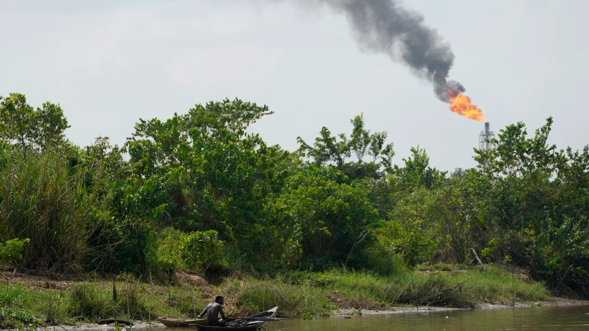 FILE - A man paddles his canoe in the Niger Delta near the village of Ogboinbiri, Nigeria, Dec. 11, 2024. (AP Photo/Sunday Alamba, File)