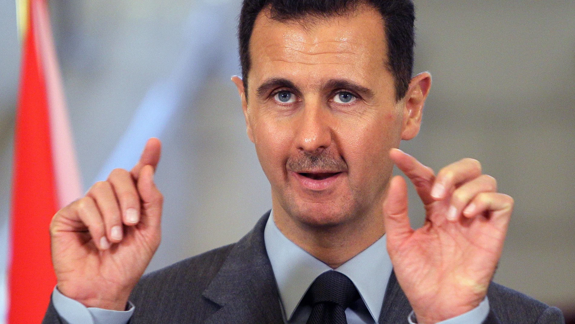 Syrian President Bashar al-Assad gestures while addressing the media during a press conference that concluded his meeting with President Traian Basescu (unseen) in Bucharest, Romania, 10 November 2010