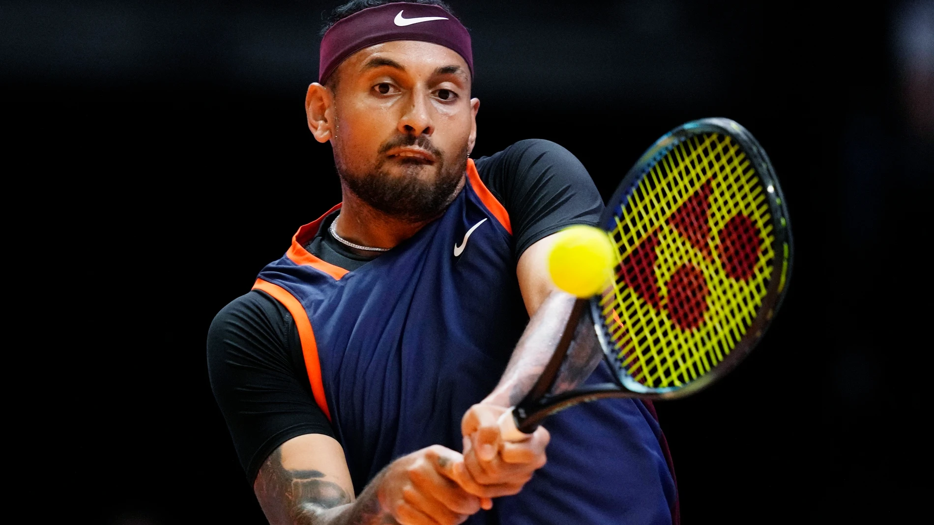 FILE - Nick Kyrgios of Eagles returns the ball to Grigor Dimitrov of Falcons during a match of Day 3 of the World Tennis League at Coca-Cola Arena in Dubai, United Arab Emirates, on Dec. 21, 2022. (AP Photo/Kamran Jebreili, File)