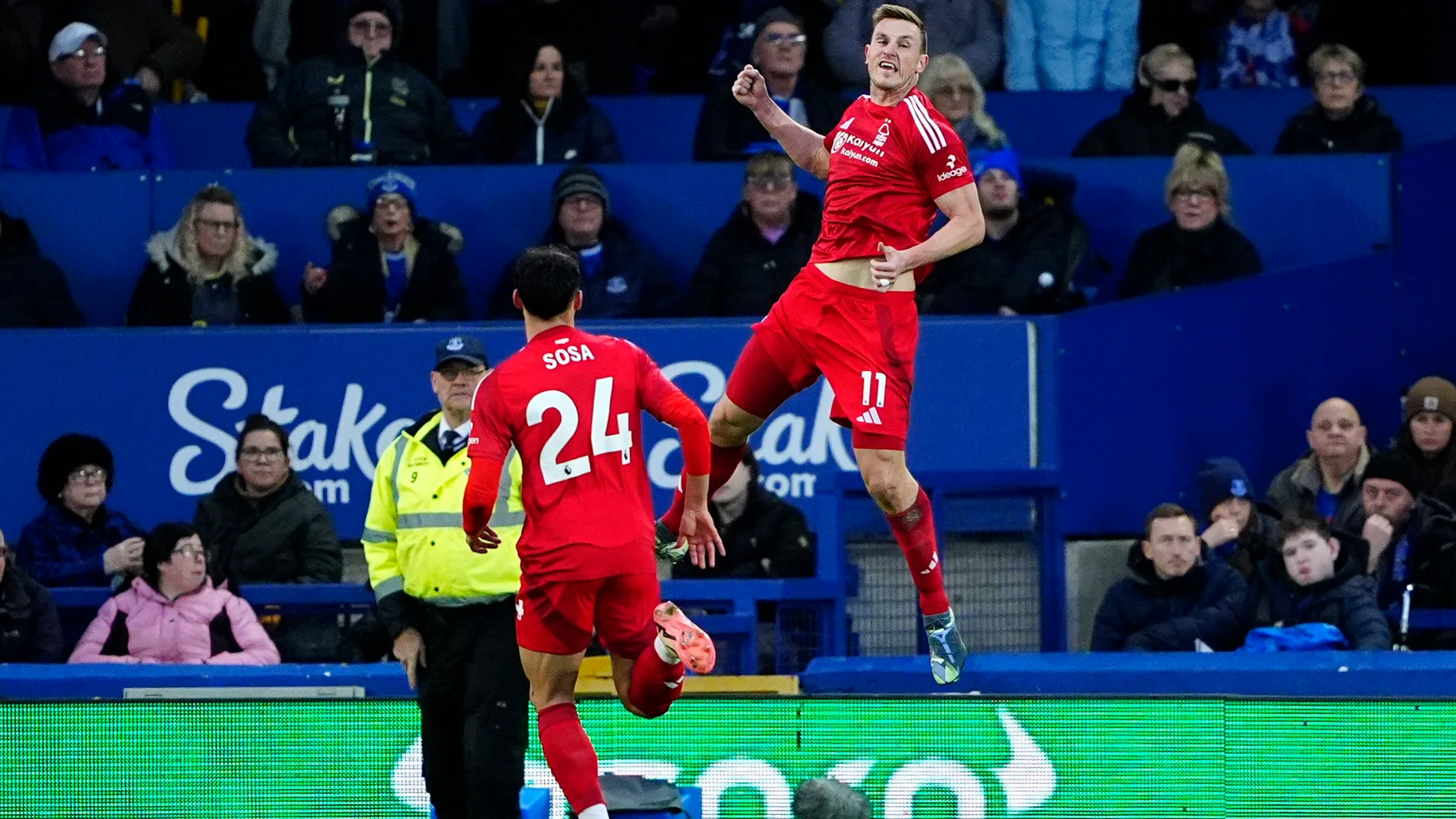 Nottingham Forest's Chris Wood, right, celebrates after scoring the opening goal during the English Premier League soccer match between Everton and Nottingham Forest at Goodison Park, Liverpool, England, Sunday, Dec. 29, 2024. (Peter Byrne/PA via AP)