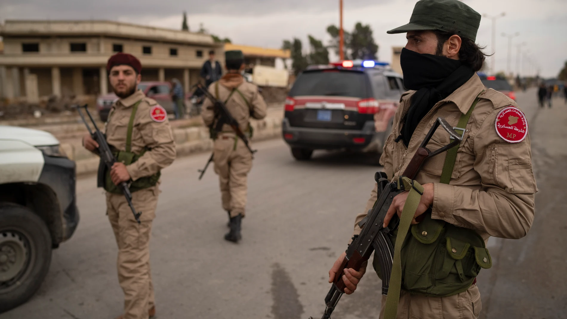Members of the security forces of the newly formed Syrian government secure the area in Adra, on the outskirts of Damascus, Syria, Monday, Dec. 30, 2024. (AP Photo/Leo Correa)
