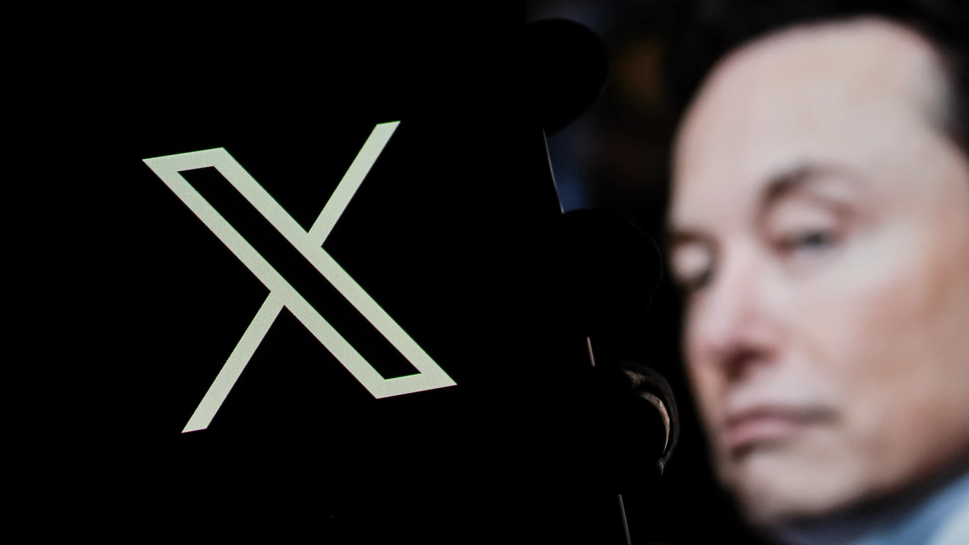 December 20, 2024, Bandung, West Java, Indonesia: In this photo illustration, X logo is displayed on a smartphone with Elon musk profile in the background Europa Press/Contacto/Algi Febri Sugita 20/12/2024 ONLY FOR USE IN SPAIN