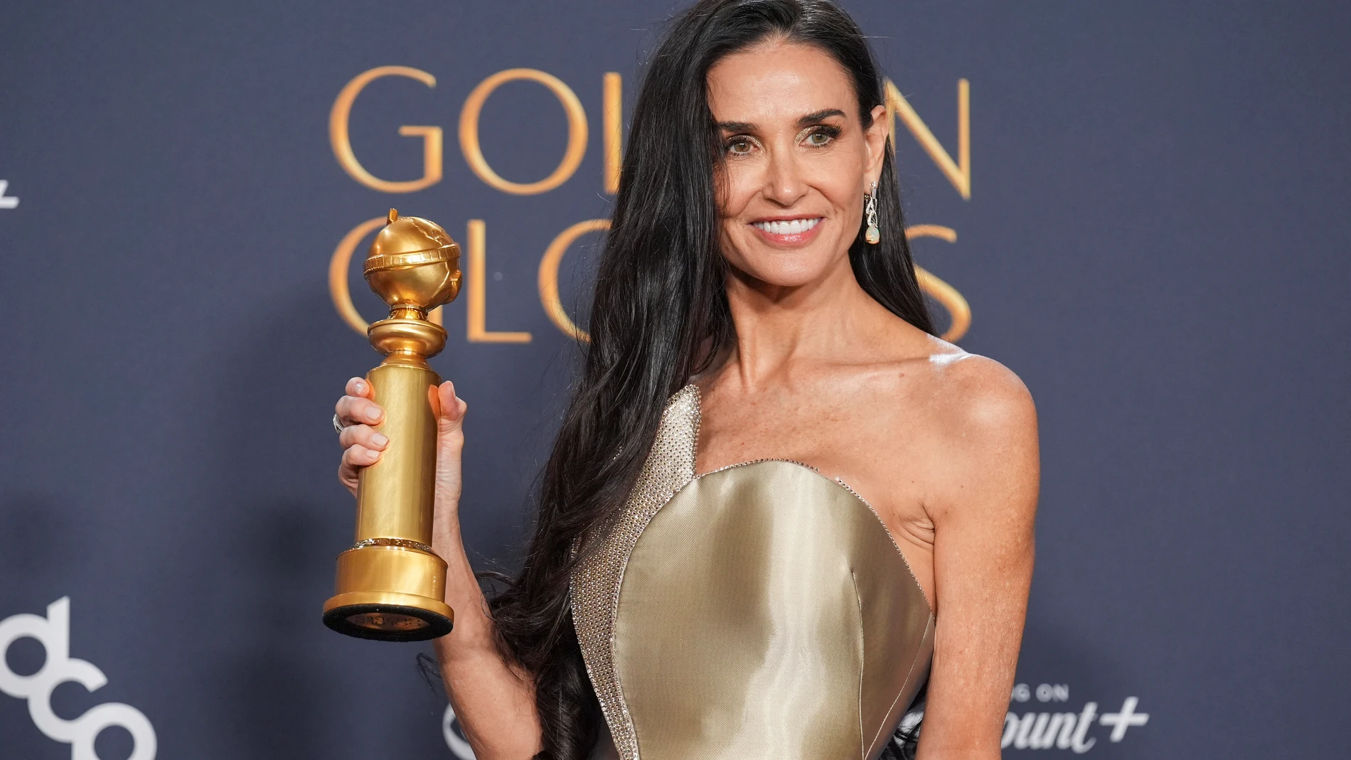 Demi Moore poses in the press room with the award for best performance by a female actor in a motion picture - musical or comedy for "The Substance" during the 82nd Golden Globes on Sunday, Jan. 5, 2025, at the Beverly Hilton in Beverly Hills, Calif. (AP Photo/Chris Pizzello)