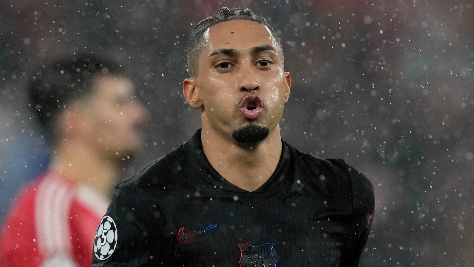 Barcelona's Raphinha celebrates his side's fifth goal during a Champions League opening phase soccer match between SL Benfica and FC Barcelona at the Luz stadium in Lisbon, Tuesday, Jan. 21, 2025. (AP Photo/Armando Franca)