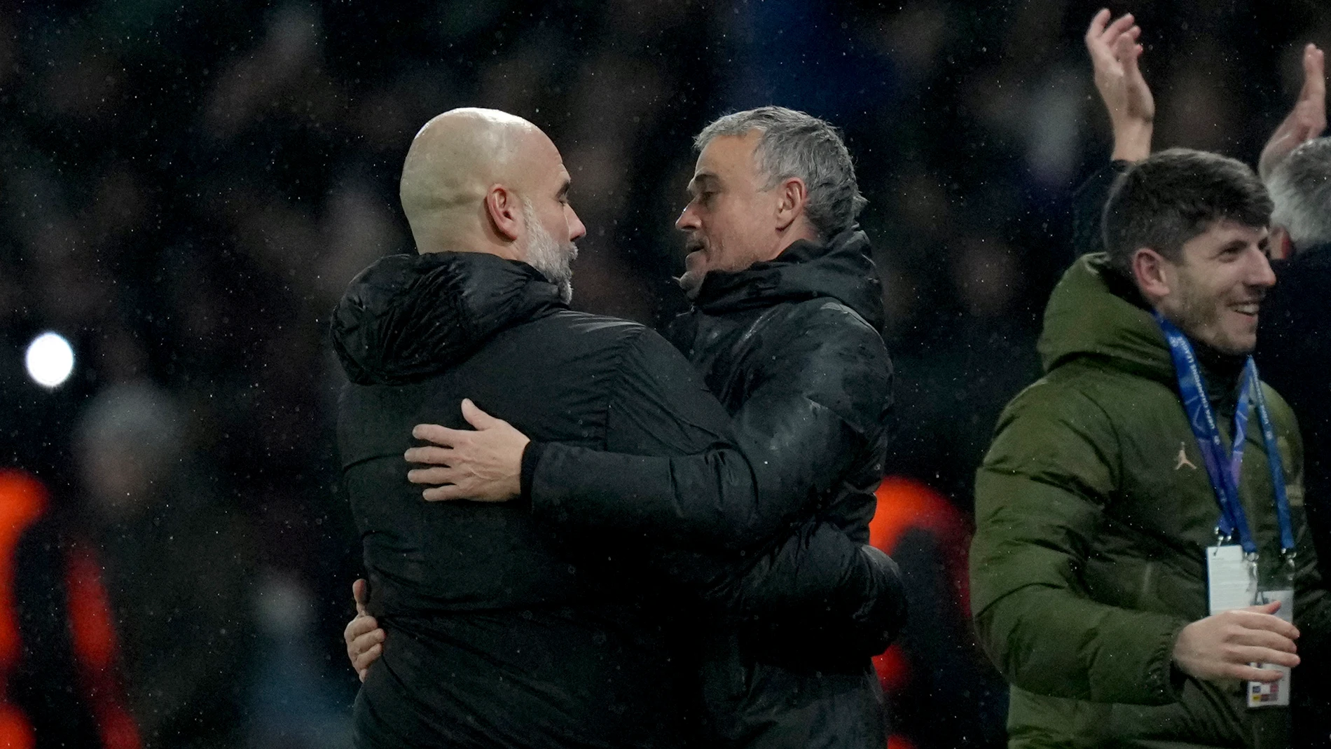 Manchester City's head coach Pep Guardiola, left, and PSG's head coach Luis Enrique embrace each other at the end of a Champions League opening phase soccer match between Paris Saint-Germain and Manchester City at the Parc des Princes in Paris, Wednesday, Jan. 22, 2025. (AP Photo/Thibault Camus)