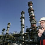 A worker of the Repsol refinery is seen speaking with a walkie talkie in Tarragona, Spain.