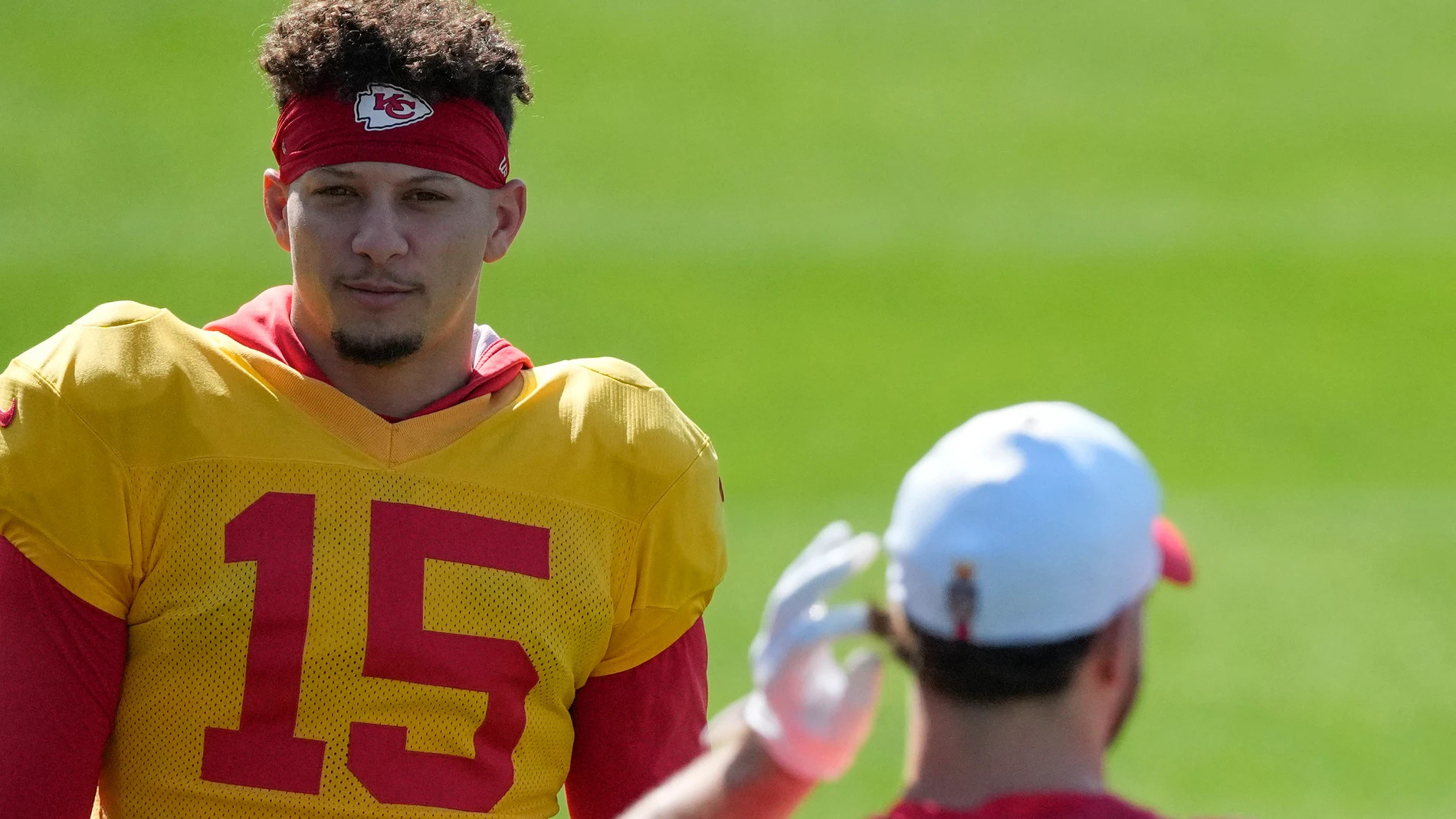 Kansas City Chiefs quarterback Patrick Mahomes (15) talks with tight end Anthony Firkser (85) during an NFL football practice Wednesday, Feb. 5, 2025, in New Orleans, ahead of Super Bowl 59 against the Philadelphia Eagles. (AP Photo/Brynn Anderson)