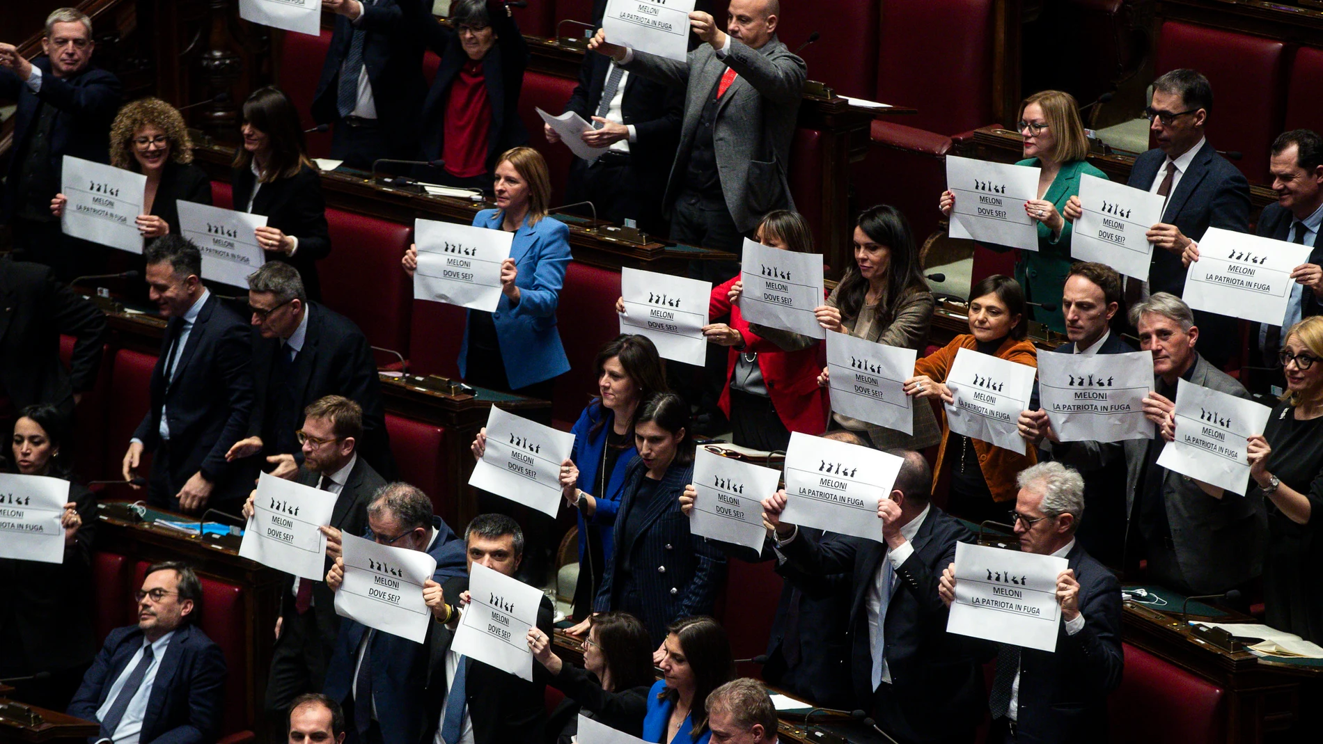 ROME (Italy), 05/02/2025.- Italy's Democratic Party (PD) MPs display placards reading "Meloni (PM) where are you" and "Meloni, the runaway patriot" during a government briefing over the case of Libyan General Osama Najim Almasri, at the Lower House in Rome, Italy, 05 February 2025. On 21 January the Italian government released and repatriated Almasri after a brief detention over an International Criminal Court (ICC) arrest warrant. The general is wanted by the ICC over allegations of war crim...