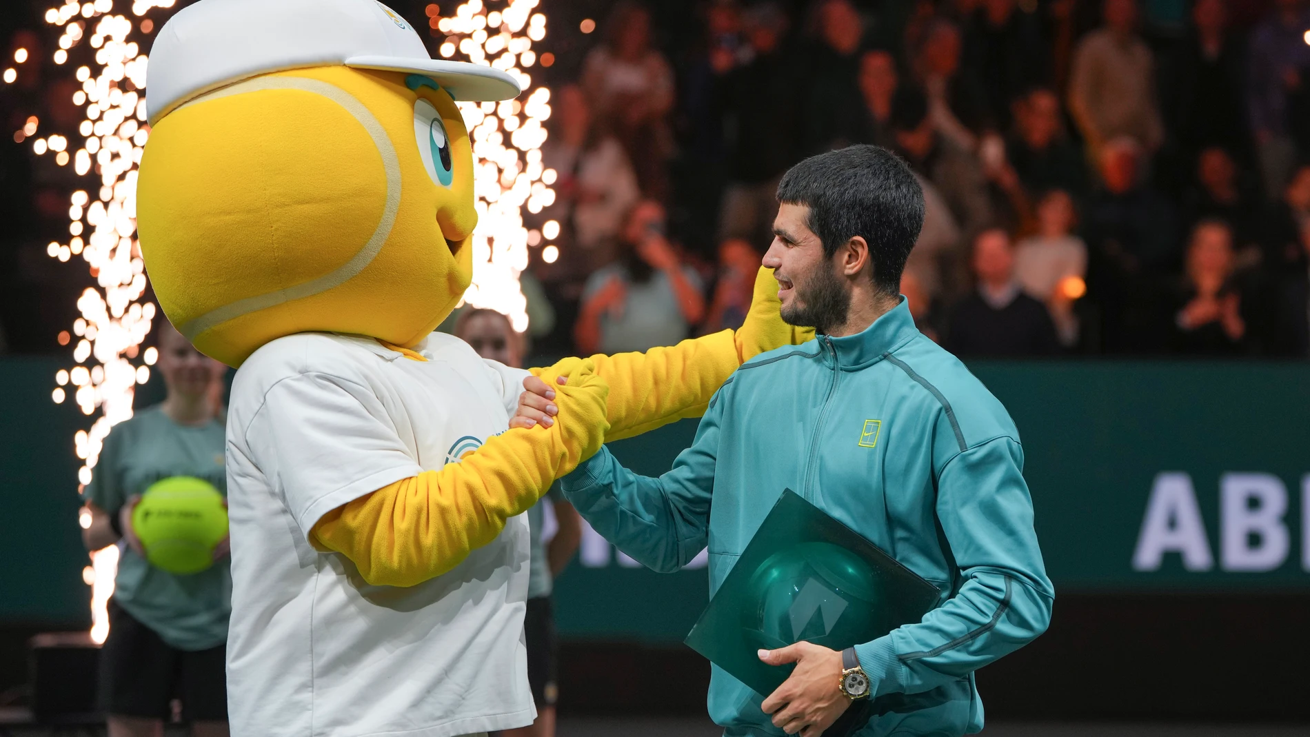 Winner Spain's Carlos Alcaraz shake hands with a mascot after the final match of the ABN AMRO Tennis Tournament in Rotterdam, Netherlands, Sunday, Feb. 9, 2025. (AP Photo/Peter Dejong)