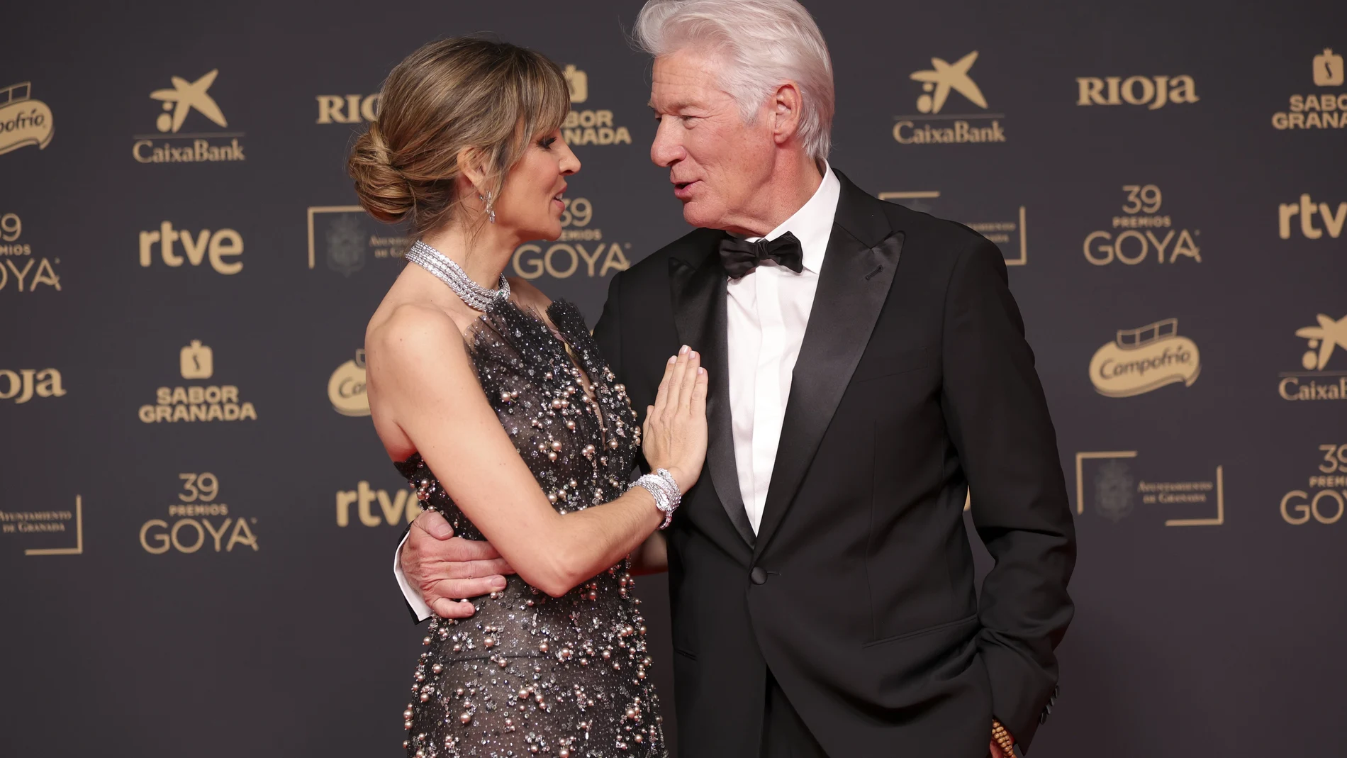 Alejandra Silva, from left, and Richard Gere pose for photographers upon arrival for the 39th Goya Awards in Granada, Spain, on Saturday, Feb. 8, 2025, in Granada.