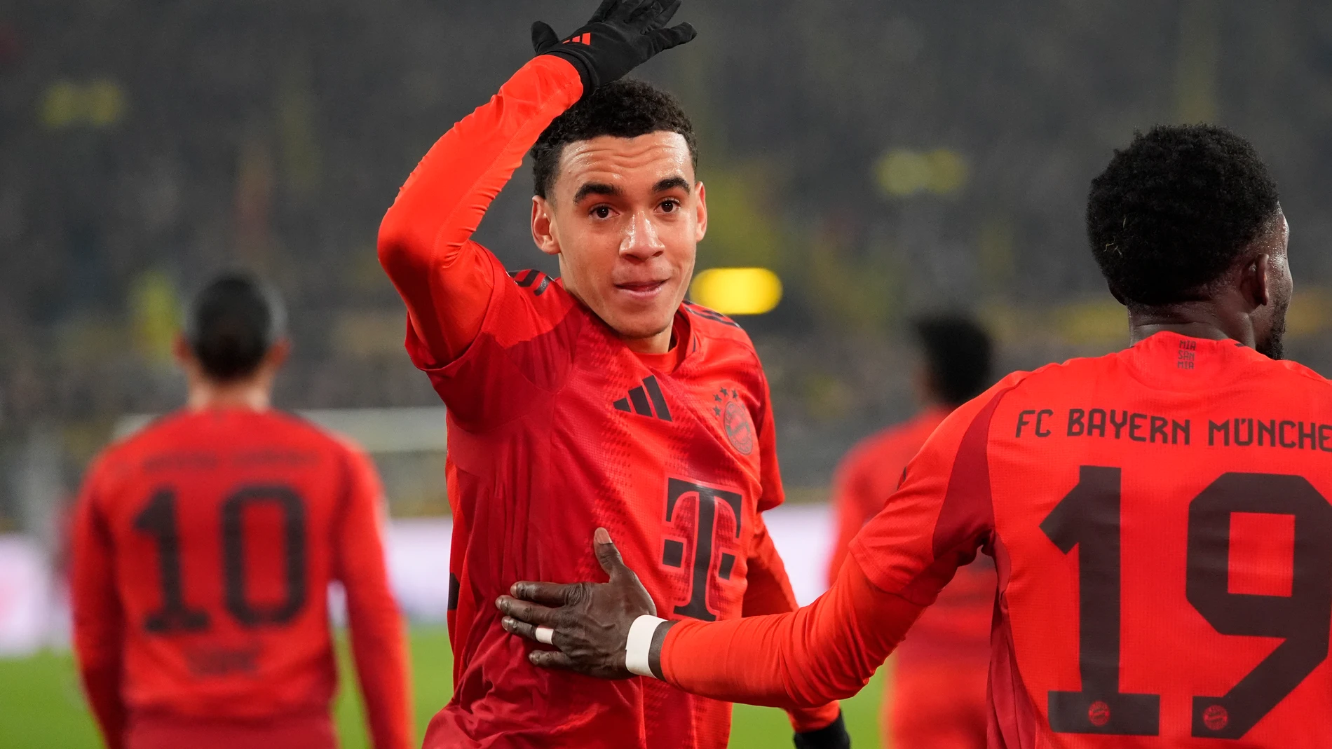 FILE - Bayern's Jamal Musiala celebrates after scoring during their German Bundesliga soccer match against Borussia Dortmund at the Signal-Iduna Park in Dortmund, Germany, Saturday, Nov. 30, 2024. (AP Photo/Martin Meissner, file)