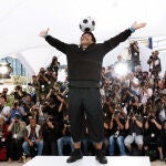 Former Argentine soccer player Diego Maradona poses during the photo call for the documentary "Maradona" during the 61st International film festival in Cannes, southern France, on Tuesday, May 20, 2008. 