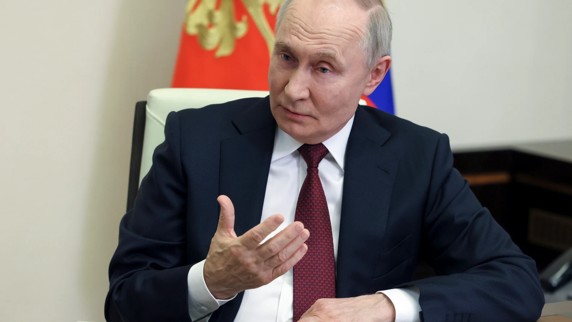 Russian President Vladimir Putin gestures during his interview with Russian journalist Pavel Zarubin at the Novo-Ogaryovo state residence outside Moscow, Russia, Monday, Feb. 24, 2025. (Mikhail Metzel, Sputnik, Kremlin Pool Photo via AP)