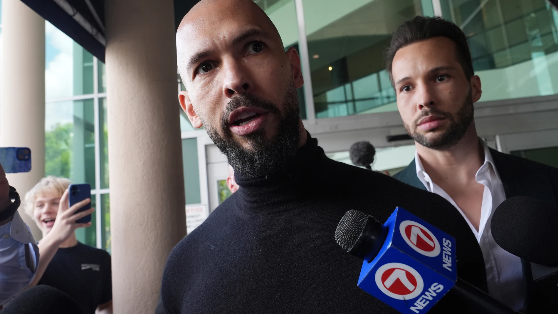 Influencer brothers Andrew and Tristan Tate arrive, Thursday, Feb. 27, 2025, in Fort Lauderdale, Fla. The brothers were charged with human trafficking in Romania and arrived in the U.S. after authorities lifted travel restrictions. (AP Photo/Marta Lavandier)