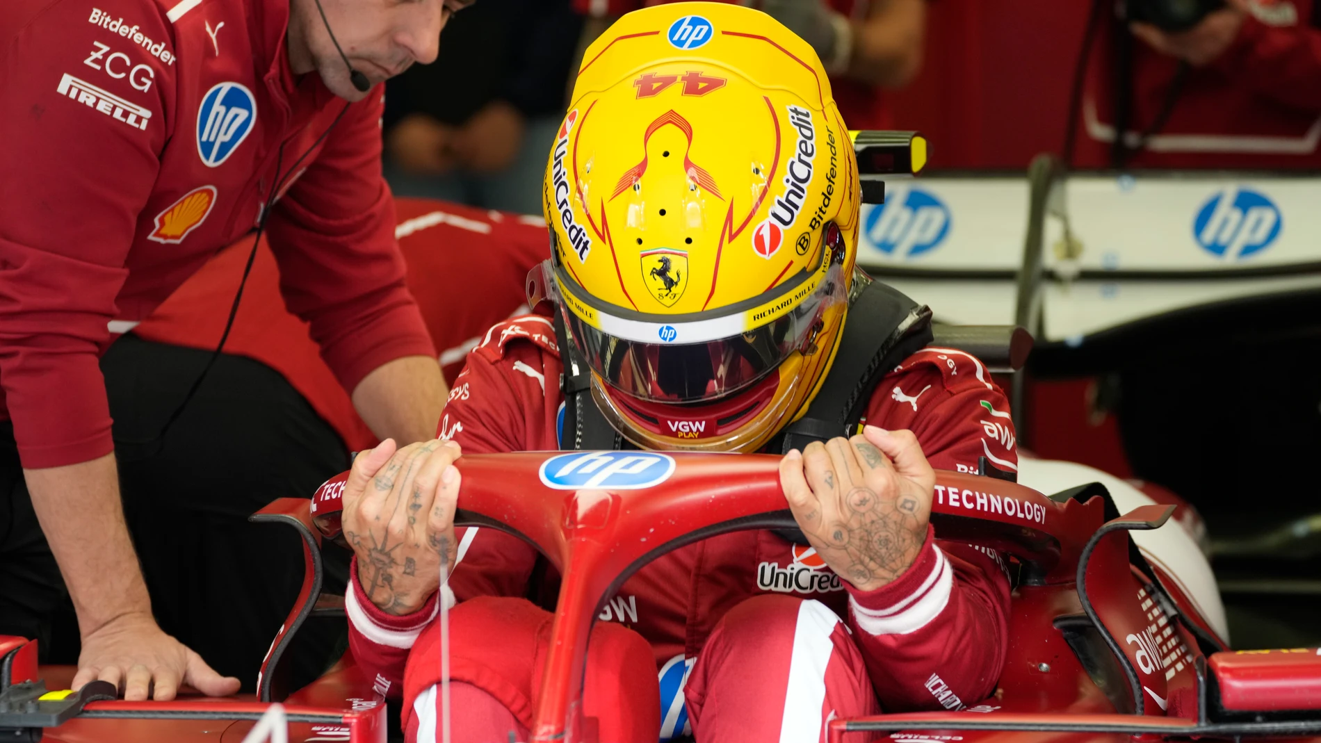 Ferrari driver Lewis Hamilton of Britain gets ready during a Formula One pre-season test at the Bahrain International Circuit in Sakhir, Bahrain, Friday, Feb. 28, 2025. (AP Photo/Darko Bandic)