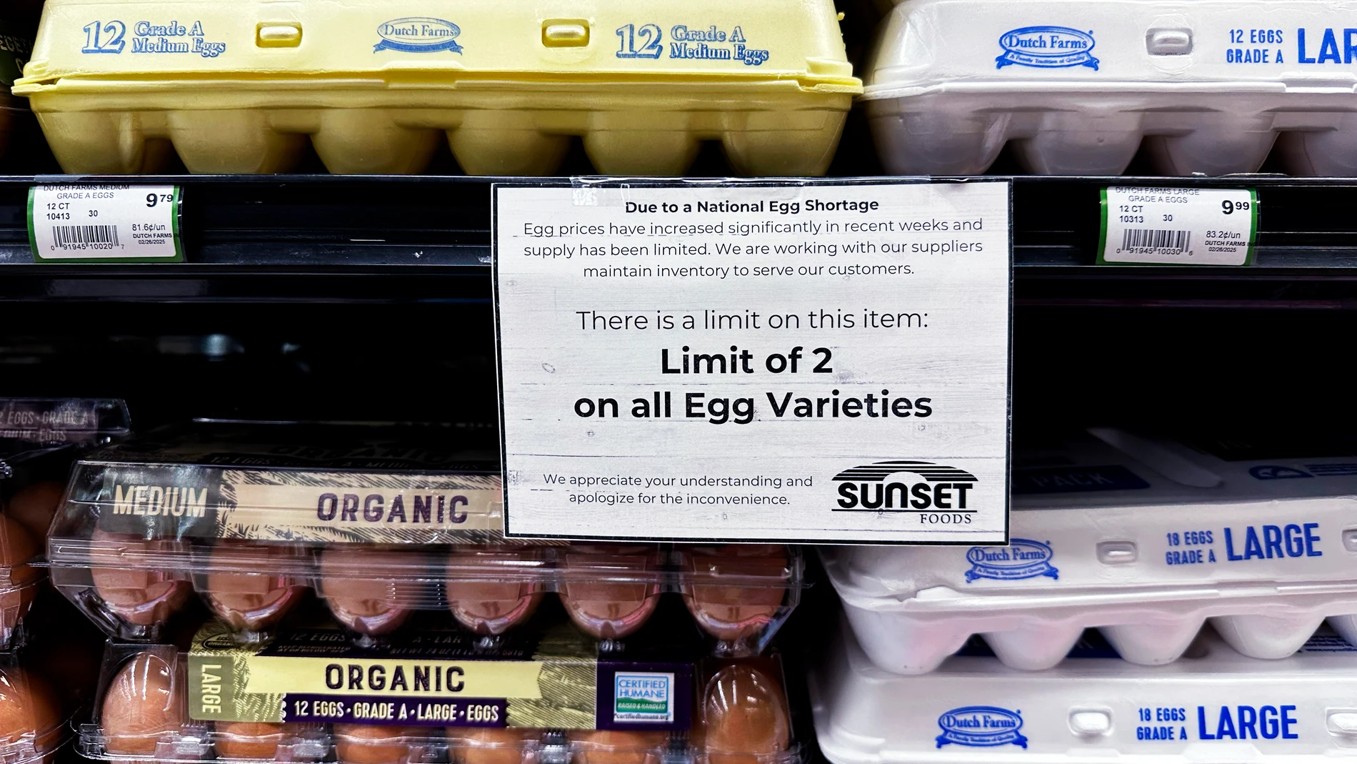 A sign is mounted on a shelve of eggs at a grocery store in Northbrook, Ill., Friday, Feb. 28, 2025. (AP Photo/Nam Y. Huh)
