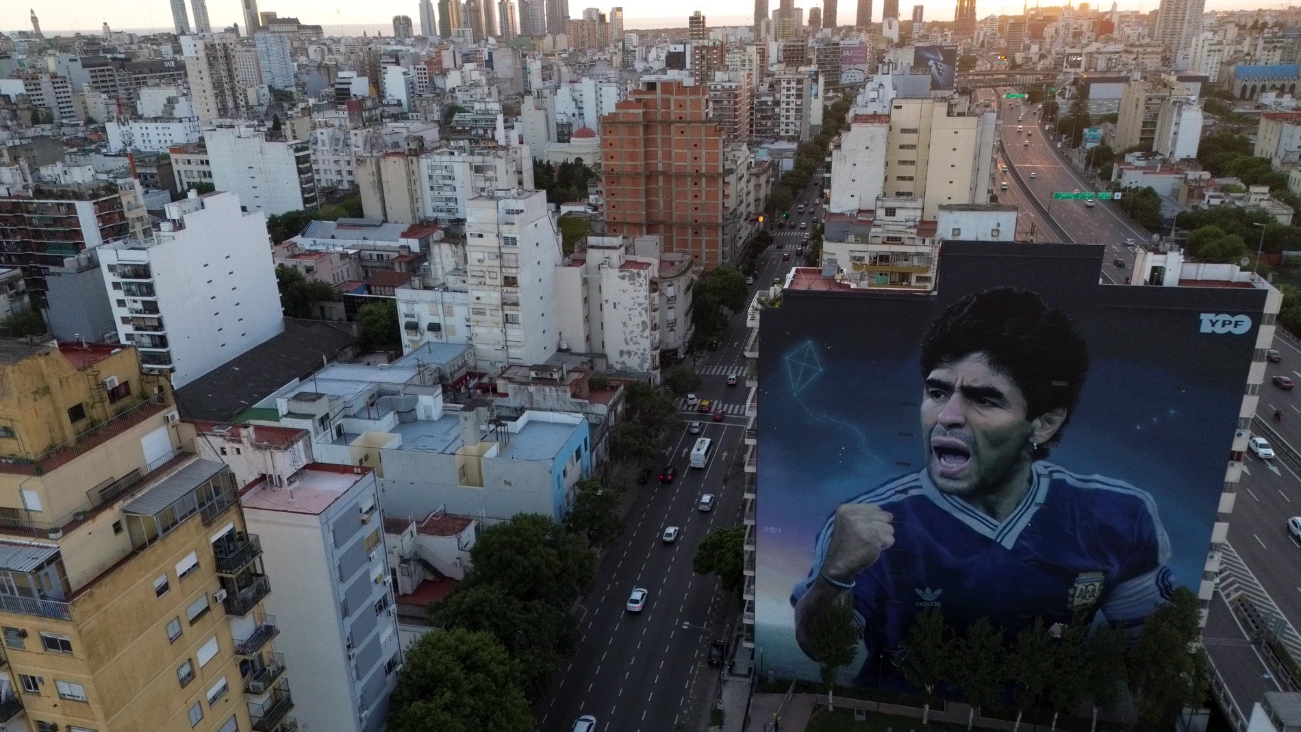 A large mural of the late soccer start Diego Maradona, by artist Martin Ron, stands in Buenos Aires, Argentina, Monday, March 10, 2025. (AP Photo/Natacha Pisarenko)