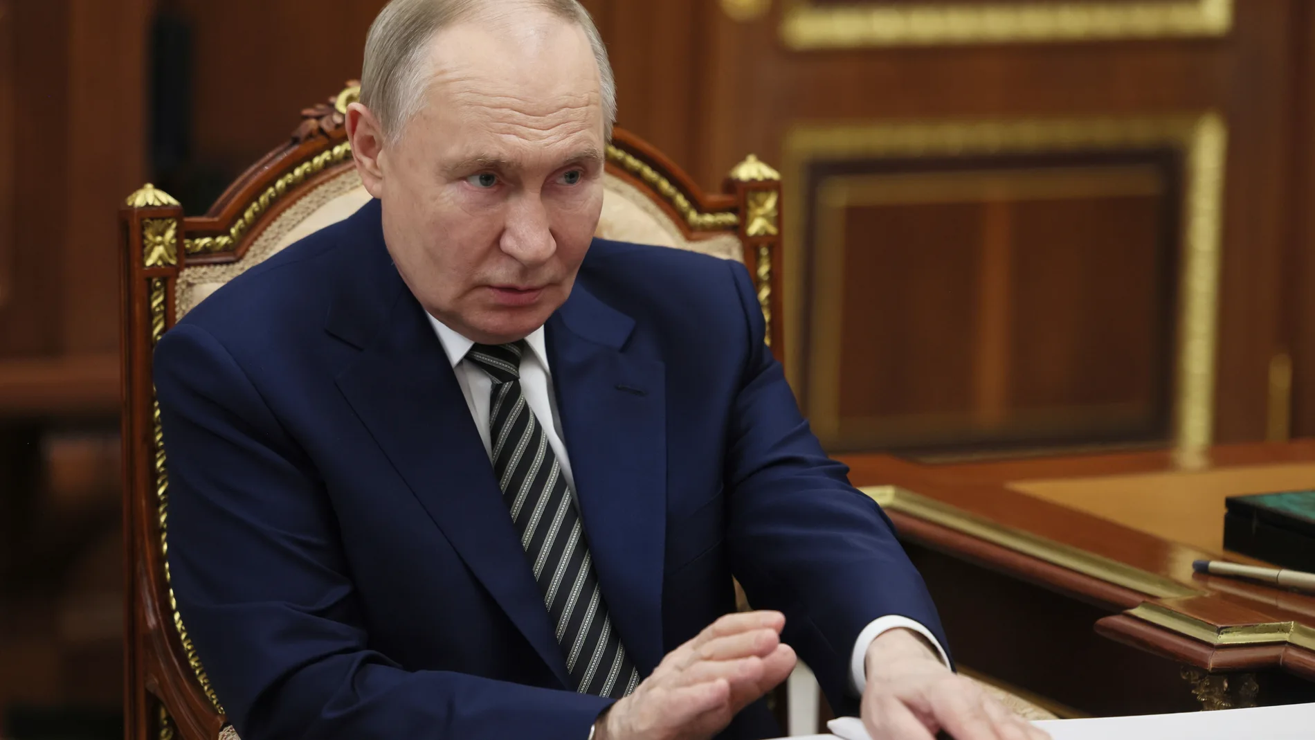 Russian President Vladimir Putin speaks with the governor of Arkhangelsk region Alexander Tsybulsky during their meeting at the Kremlin in Moscow, Russia, Tuesday, March 11, 2025. (Mikhail Metzel, Sputnik, Kremlin Pool Photo via AP)