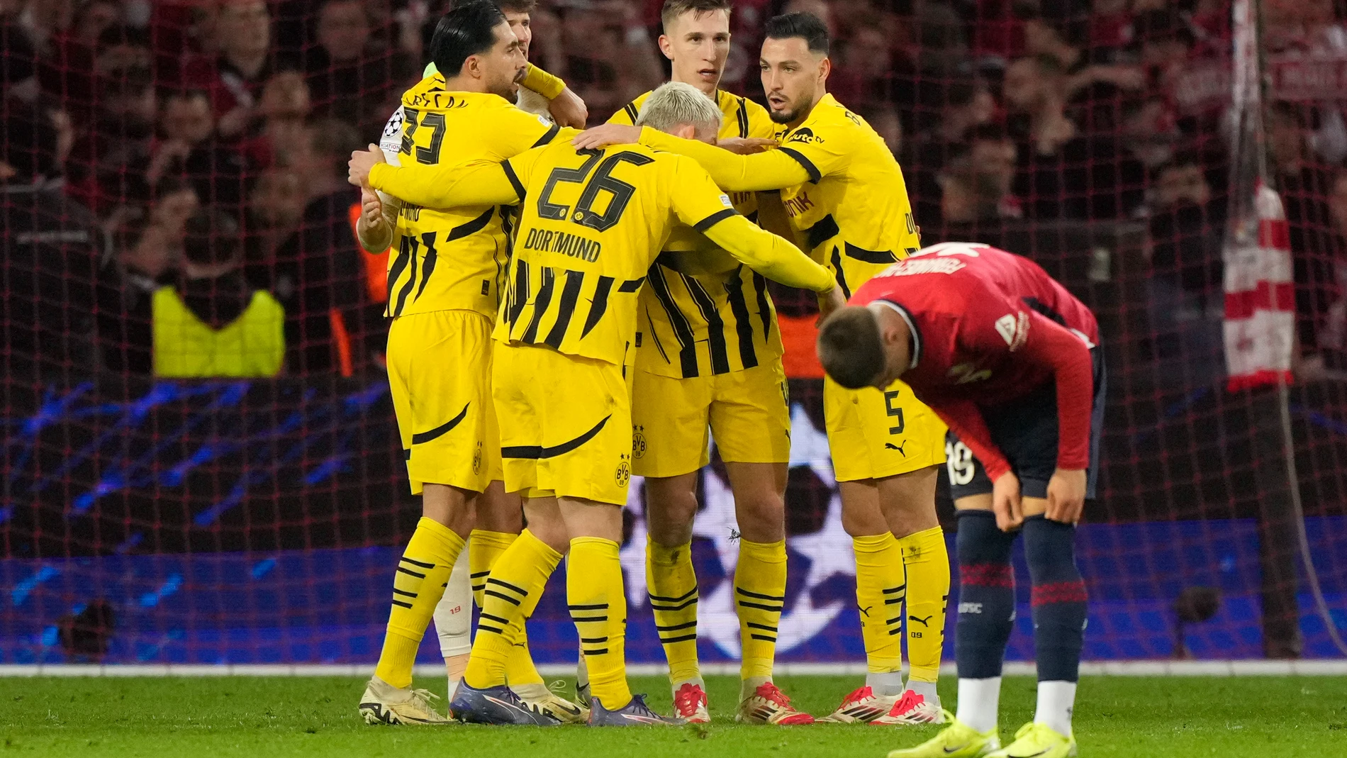 Dortmund players celebrate after the Champions League round of 16 second leg soccer match between Lille and Borussia Dortmund in Villeneuve-d'Ascq , Wednesday, March 12, 2025. (AP Photo/Michel Euler)