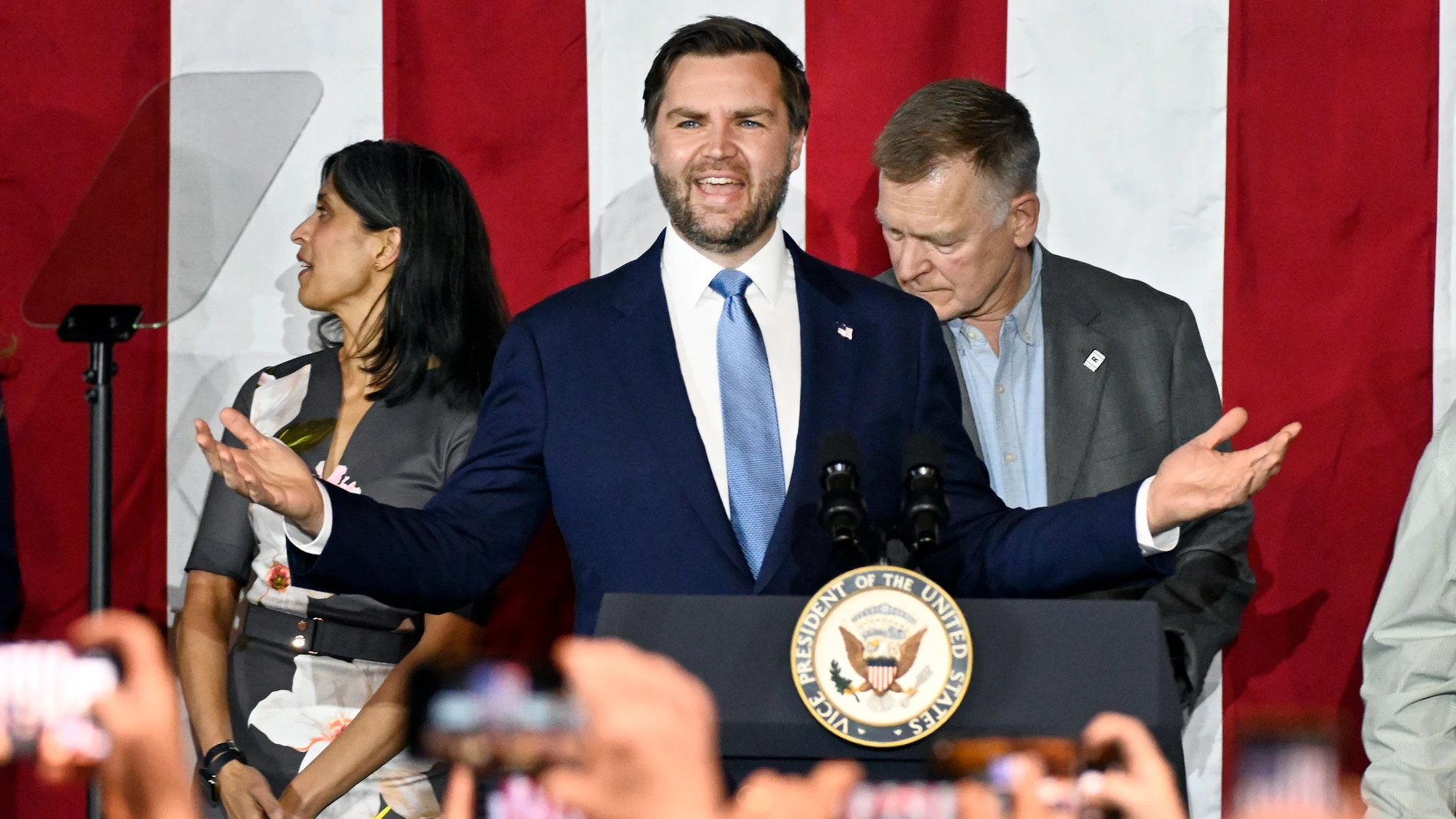 Vice President JD Vance, center, speaks at a rally about "America's industrial resurgence," Friday, March 14, 2025, at Vantage Plastics in Bay City, Mich. (AP Photo/Jose Juarez)