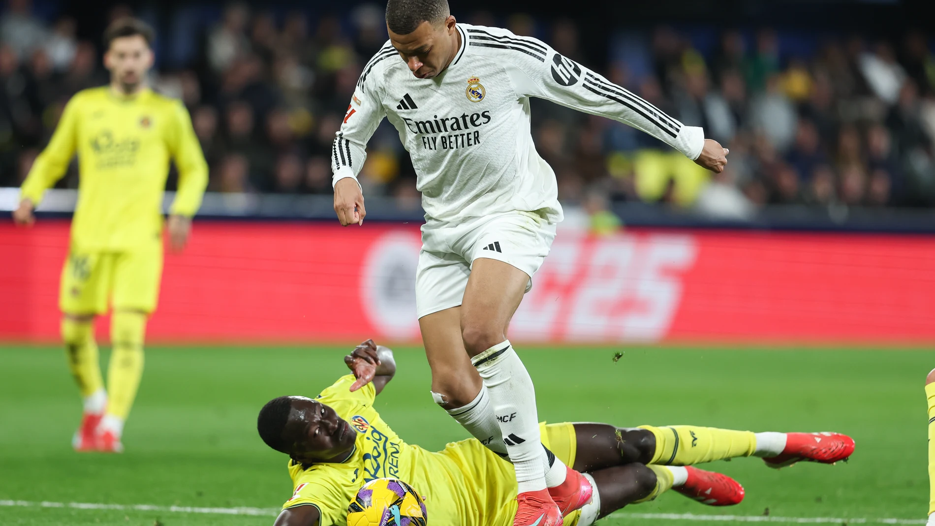 Pape Gueye of Villarreal and Kylian Mbappe of Real Madrid in action during the Spanish league, LaLiga EA Sports, football match played between Villarreal CF and Real Madrid CF at La Ceramica stadium on March 15, 2025, in Villarreal, Spain. AFP7 15/03/2025 ONLY FOR USE IN SPAIN